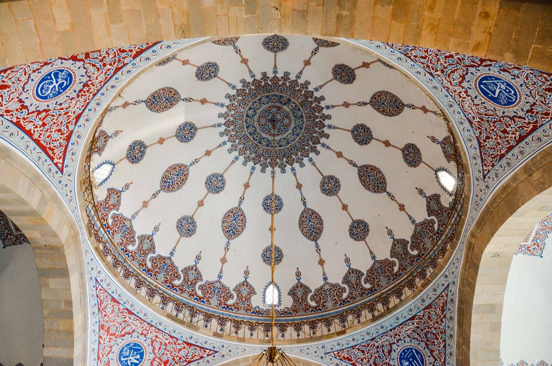 Intricate dome ceiling with Islamic patterns in a mosque in Erzurum, Türkiye.