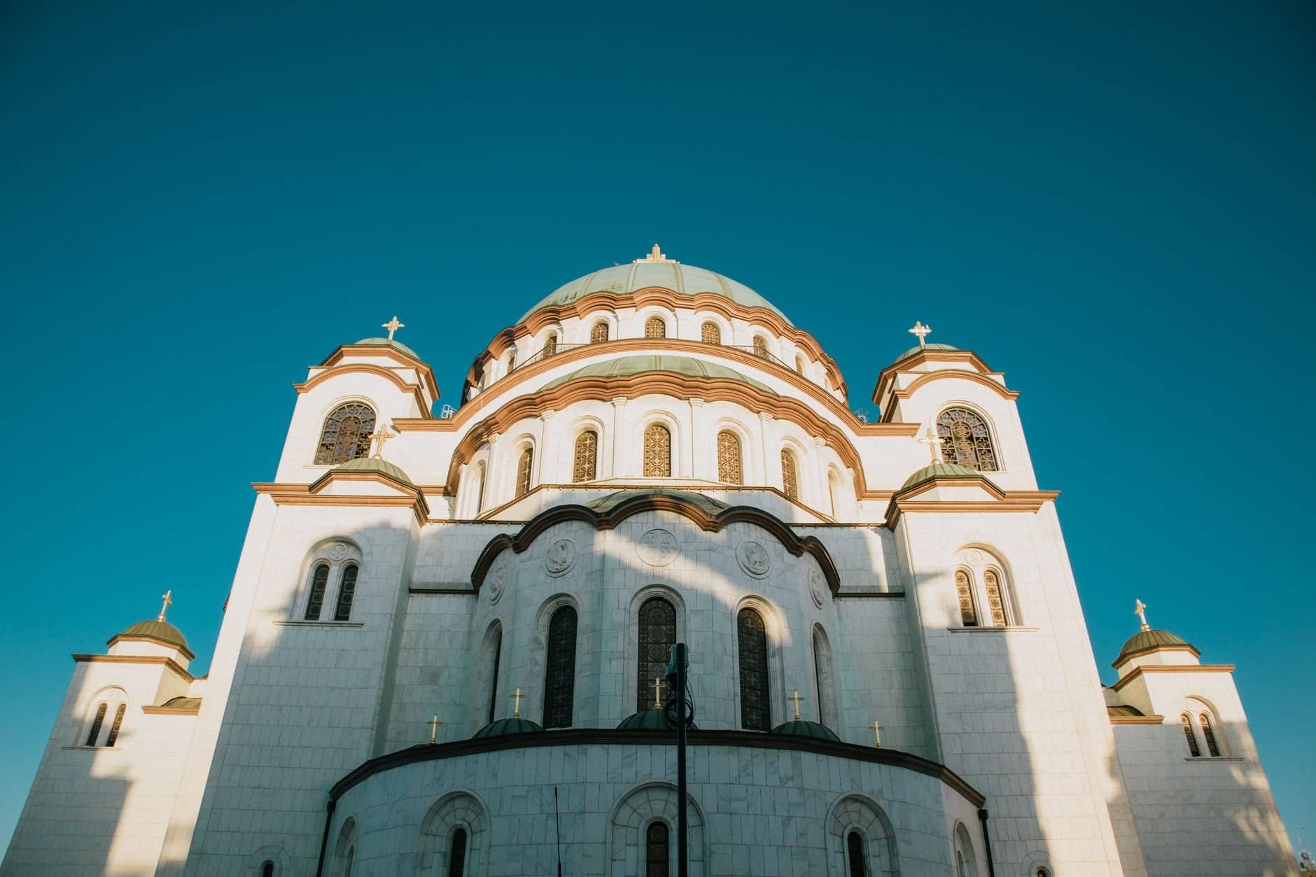 Captivating view of the Temple of Saint Sava under a clear blue sky.