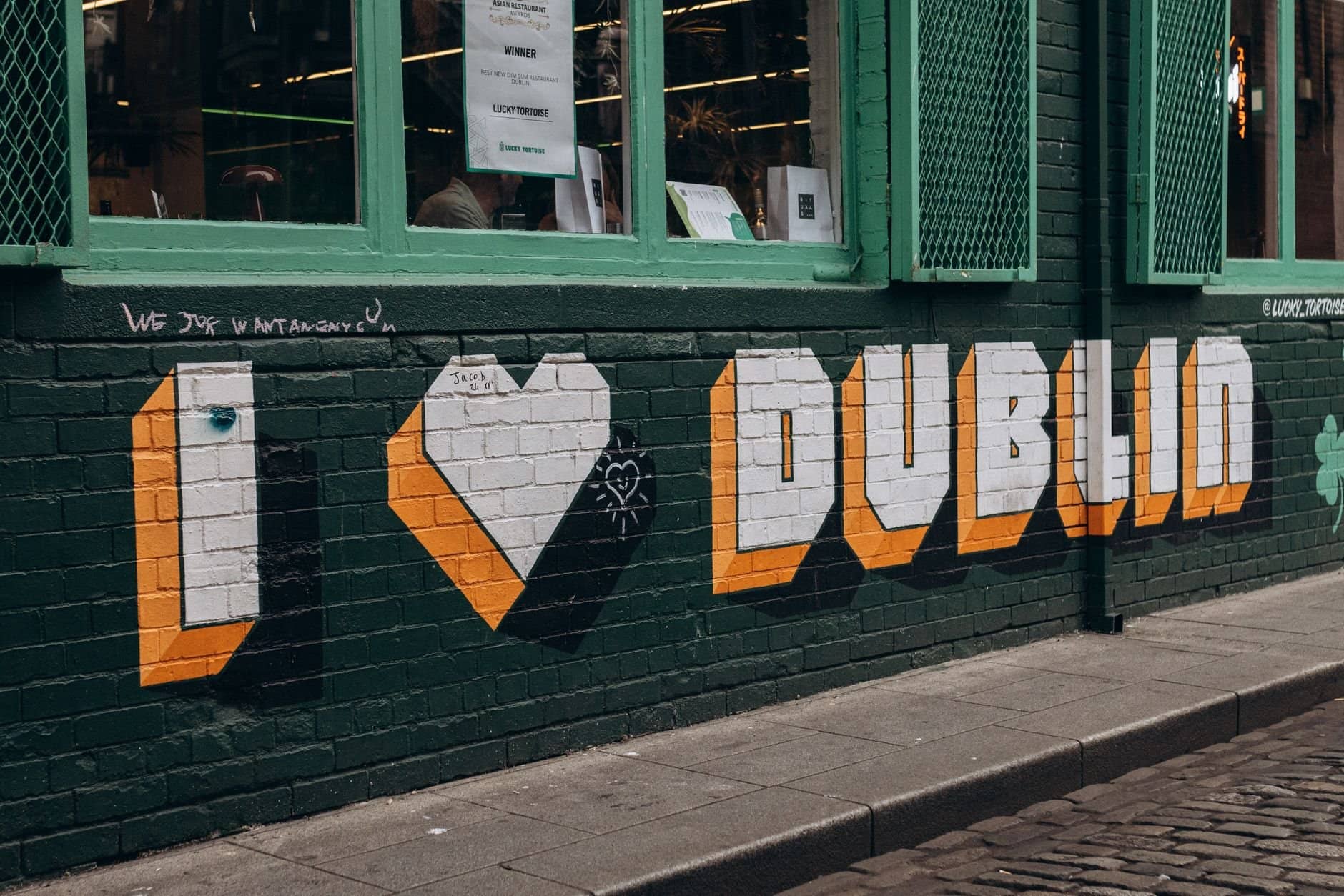 Colorful street art on a Dublin wall showcasing vibrant urban culture.