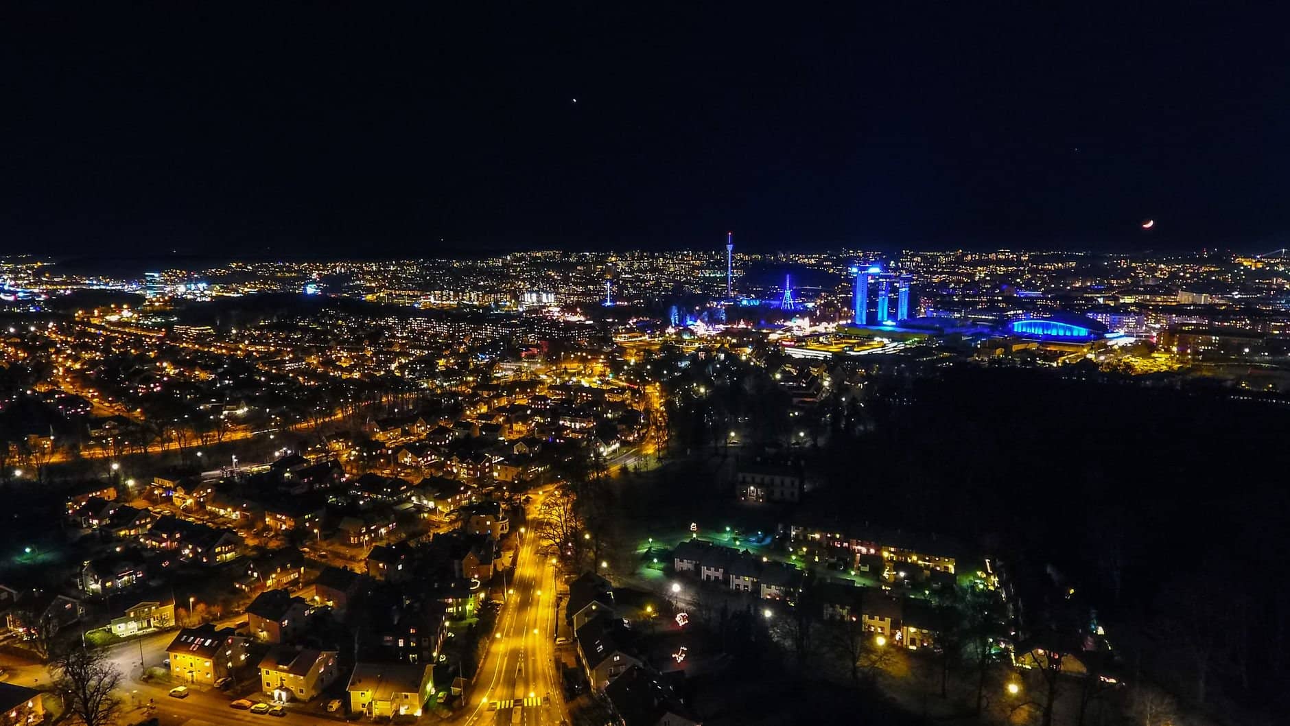 Aerial view of the illuminated Gullbergsvass cityscape at night in Sweden.