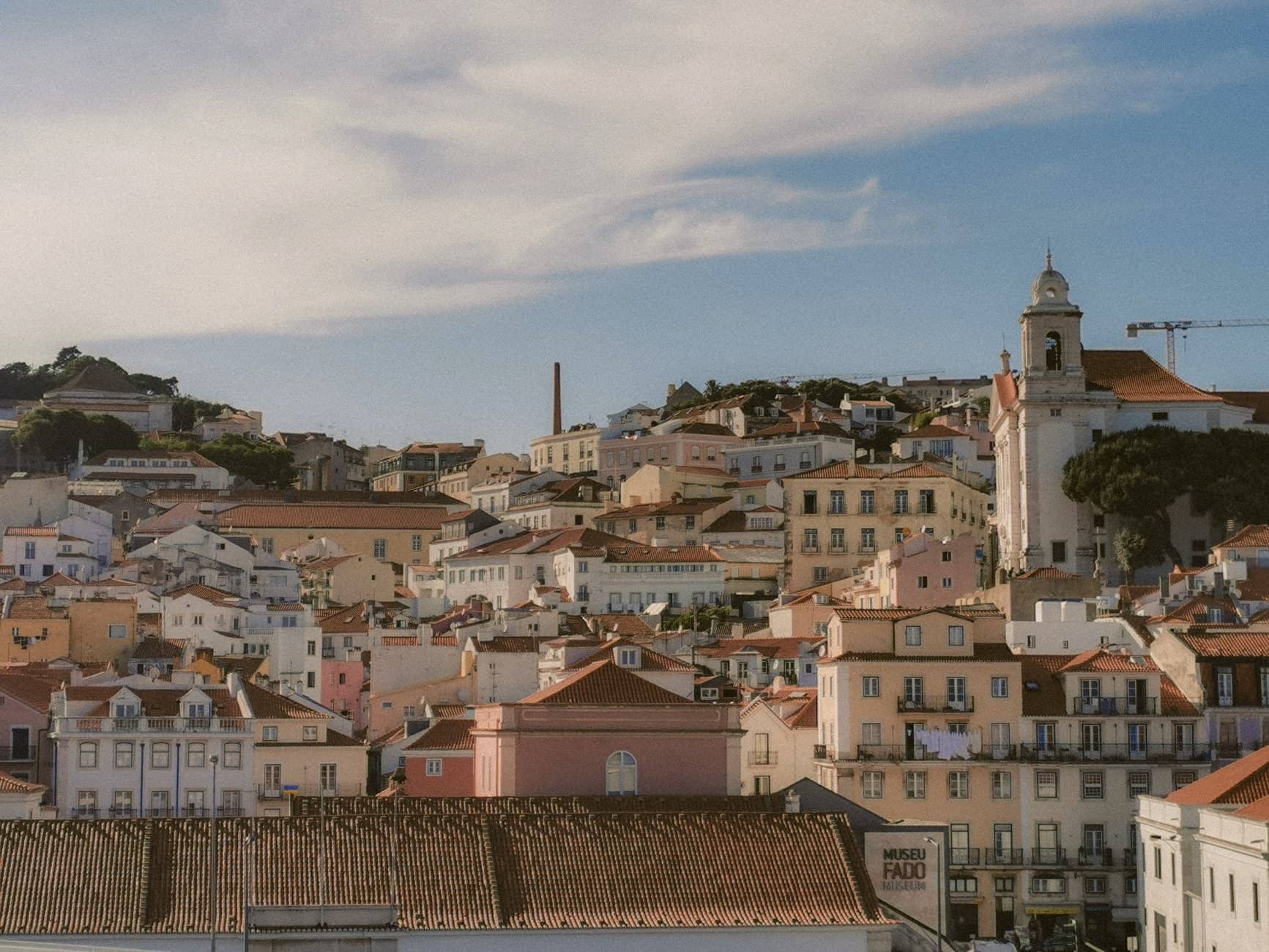Aerial view of Lisbon's charming historic architecture under a bright sky.