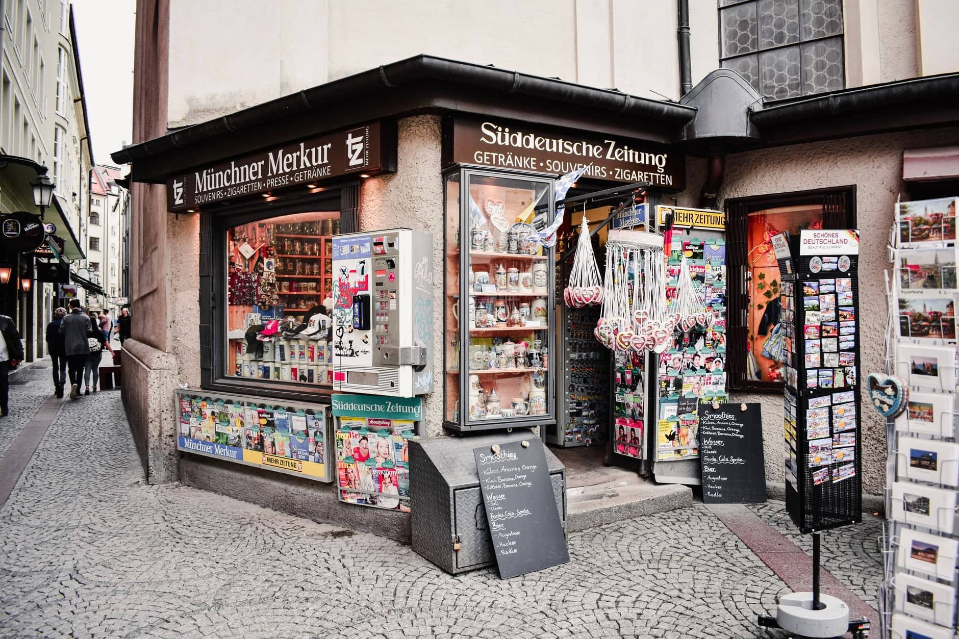 Explore the charm of Munich with this street-side kiosk in the historic Old Town, offering souvenirs and local delights.