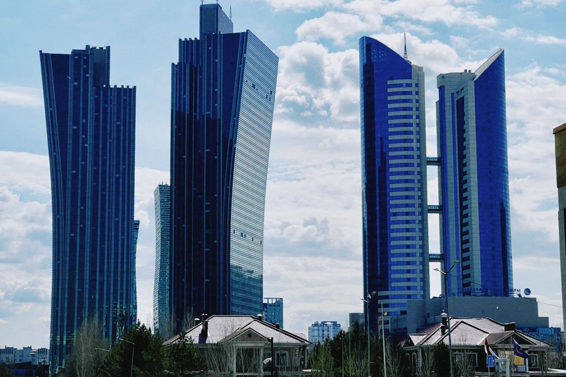 Striking view of modern skyscrapers under a blue sky in Astana, Kazakhstan.