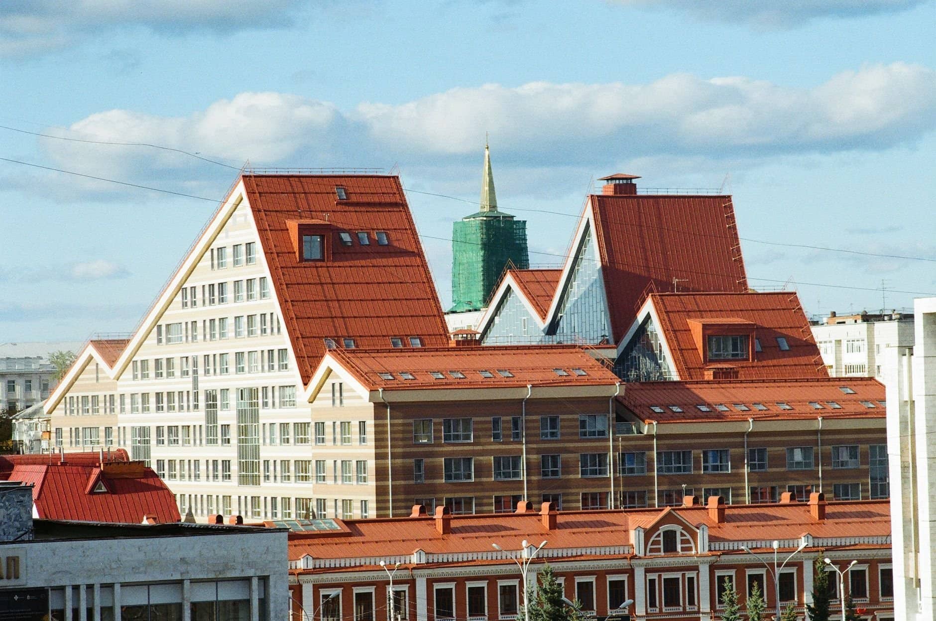 Explore the distinct architectural design of Perm's modern cityscape under a clear sky.