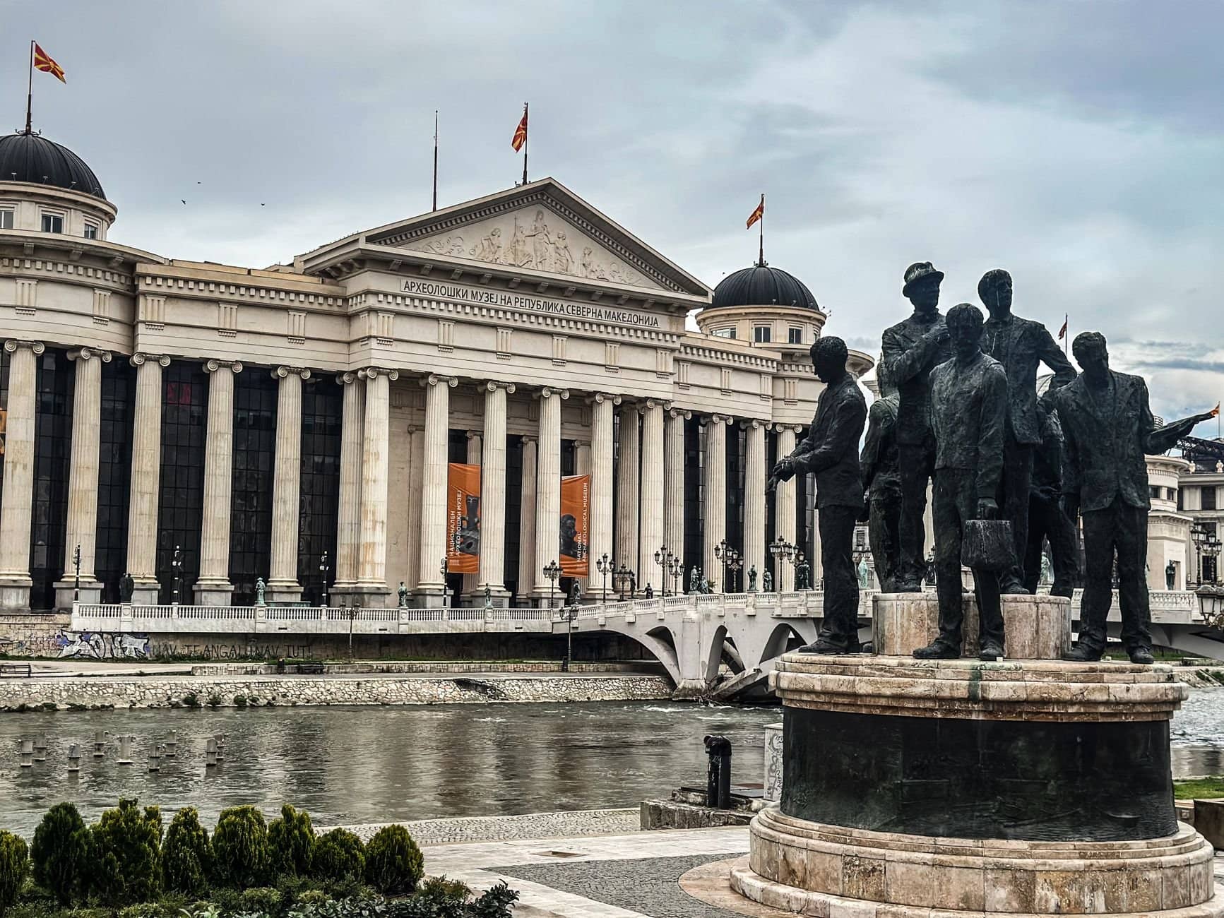 View of the Archaeological Museum and historic statues in Skopje, North Macedonia.