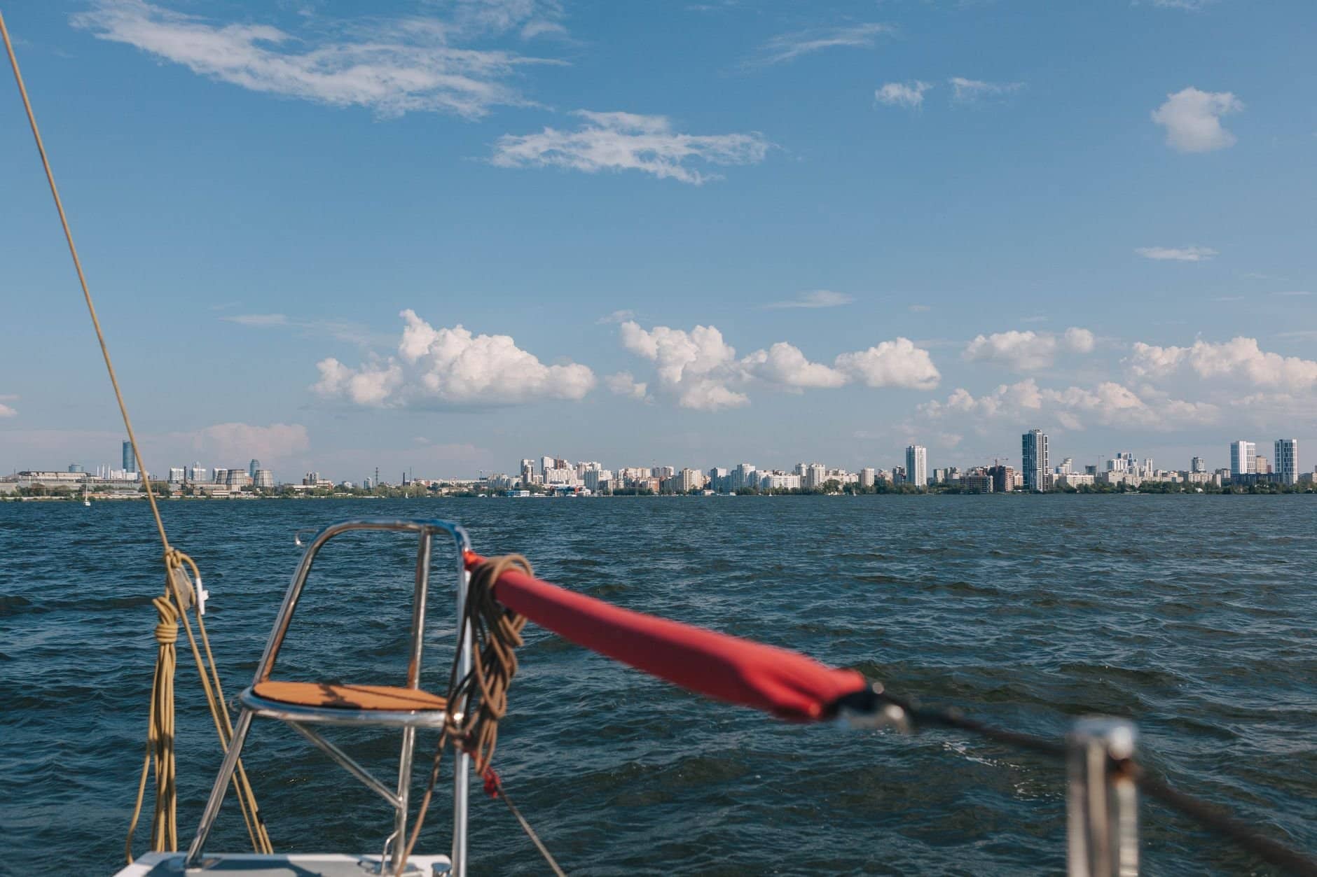Explore the beautiful skyline of Yekaterinburg, Russia from a sailboat on a clear, sunny day.