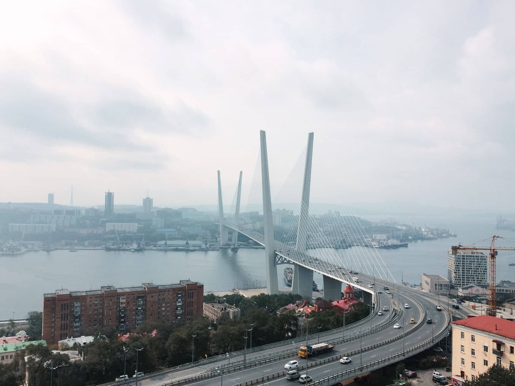 A scenic aerial view of the iconic Zolotoy Bridge in Vladivostok, Russia.
