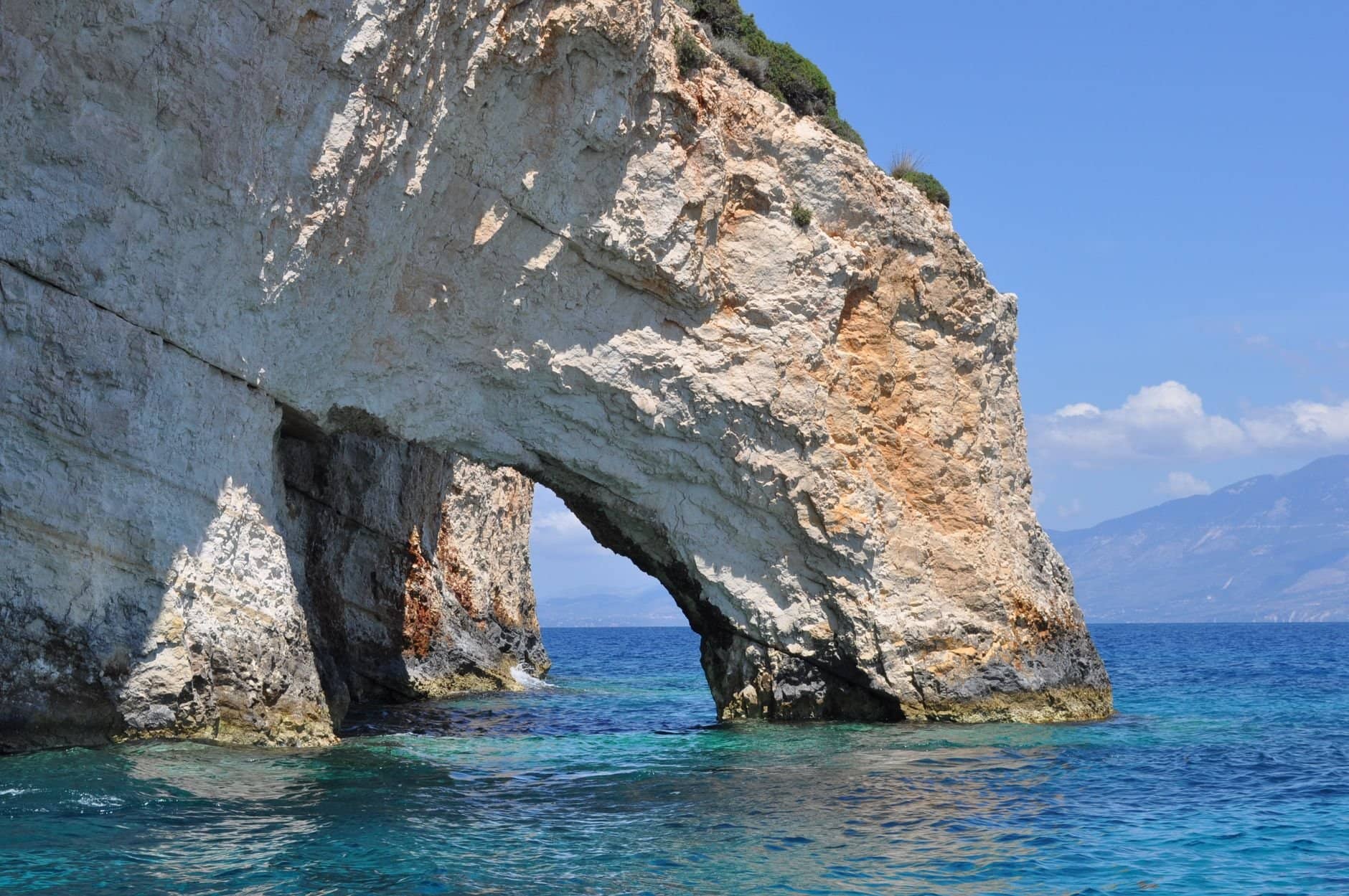 Explore the stunning rocky arch formation along the coast of Zakinthos, Greece.