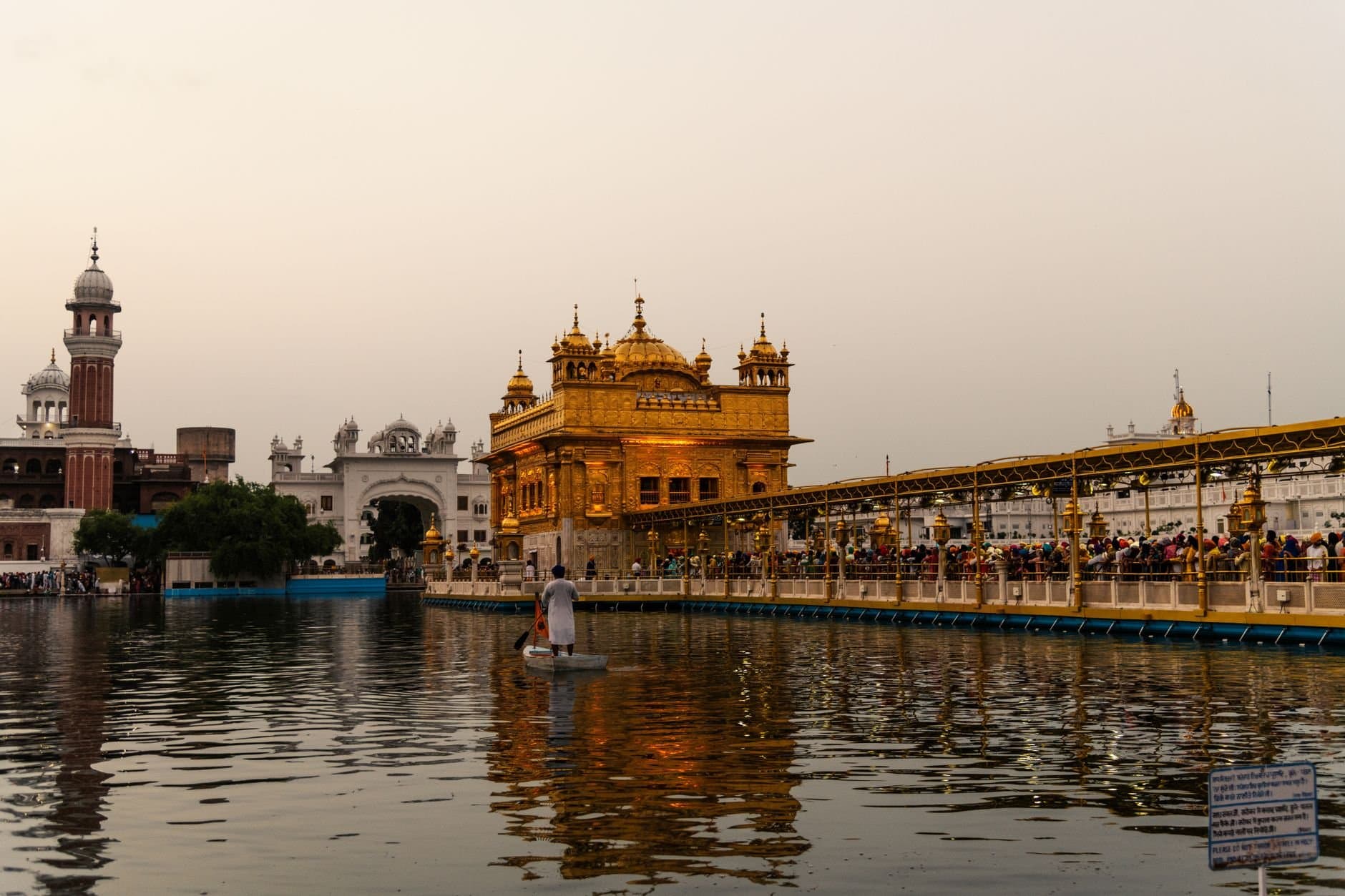 Evening view of Golden Temple in Amritsar, showcasing stunning Sikh architecture and reflections.