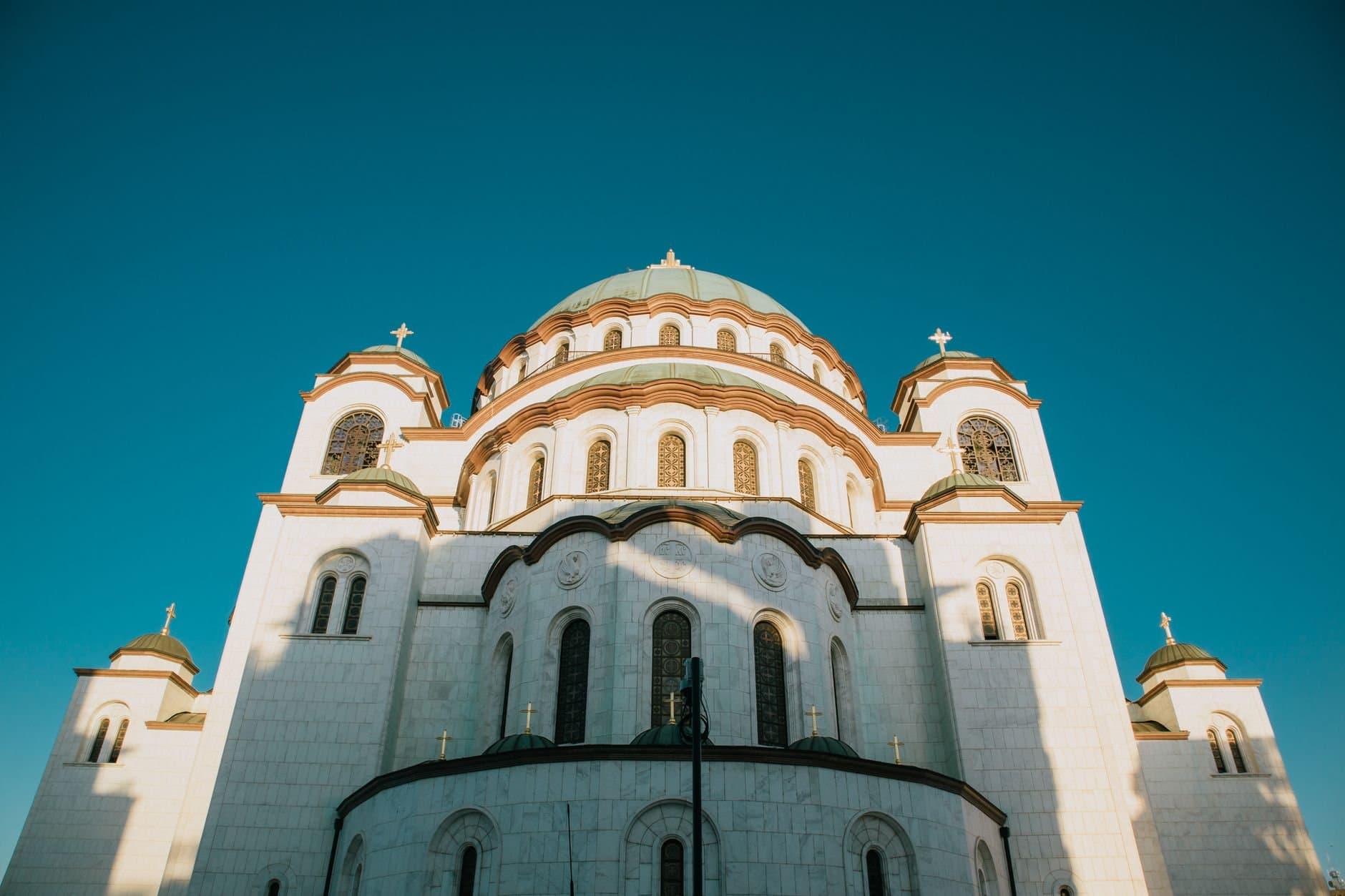 Captivating view of the Temple of Saint Sava under a clear blue sky.