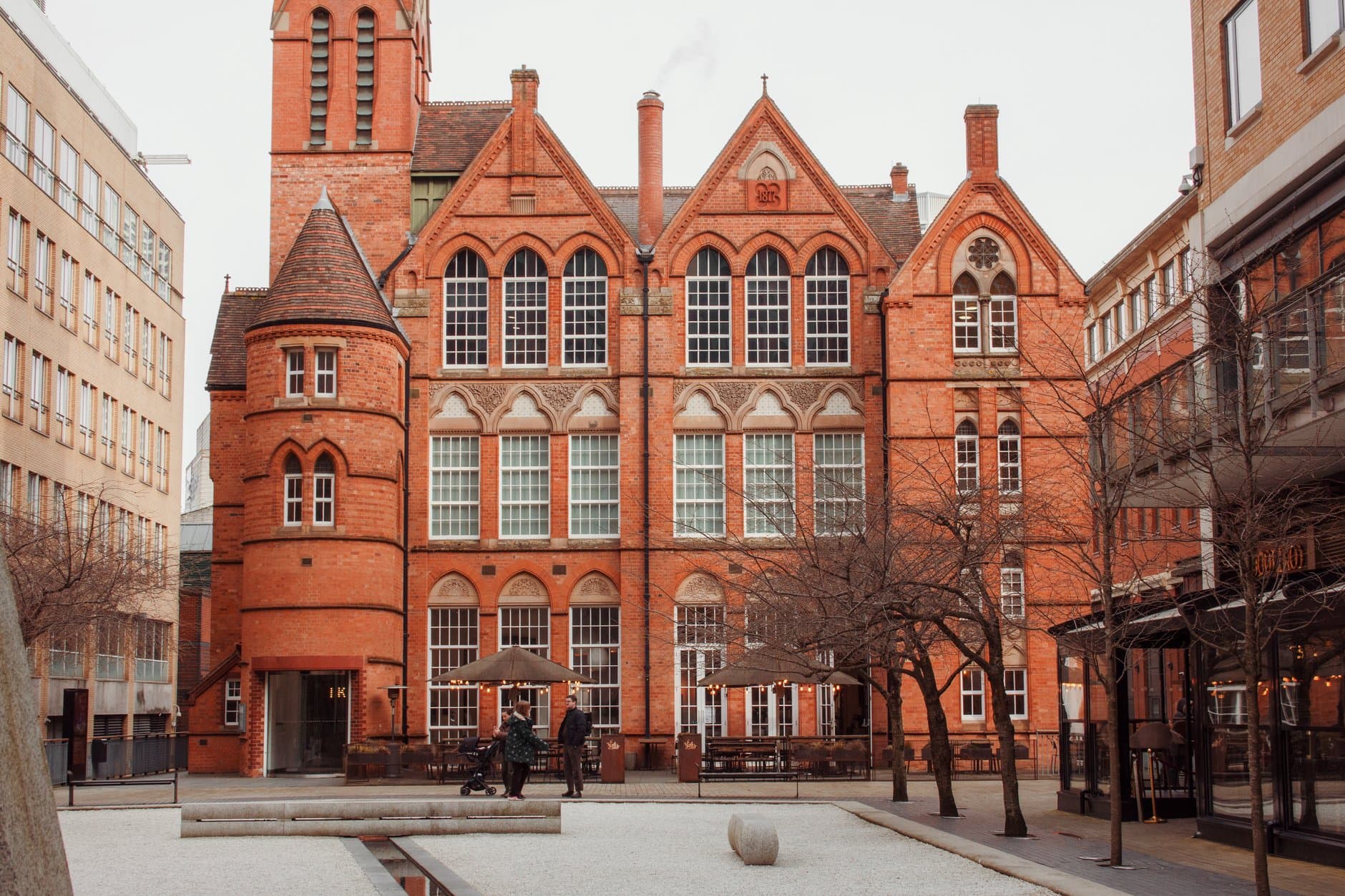 A warm-toned historic brick building in Birmingham, capturing classic architecture and city life.