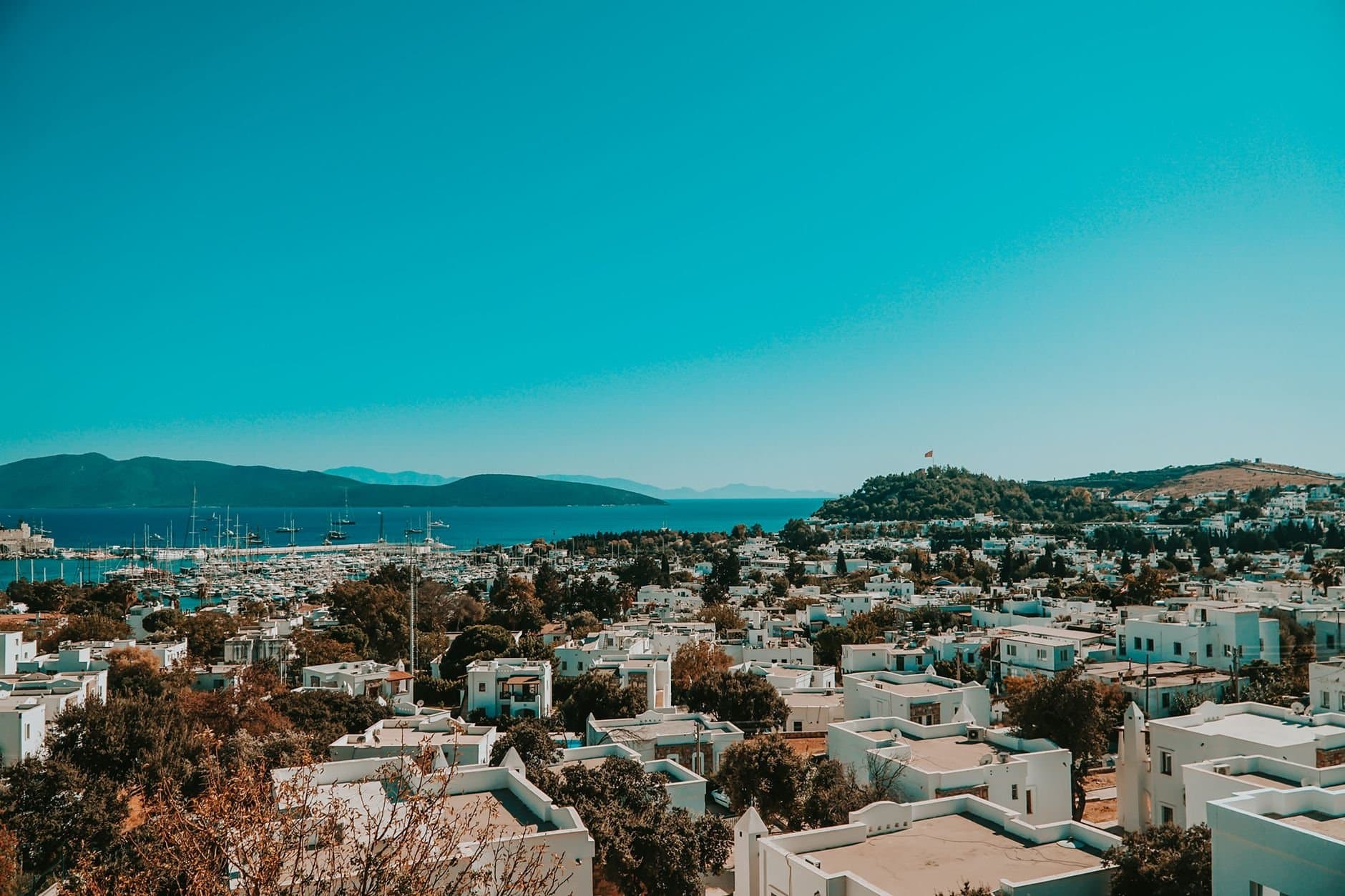 Explore the picturesque Bodrum cityscape with whitewashed buildings and the serene Aegean Sea in the backdrop.