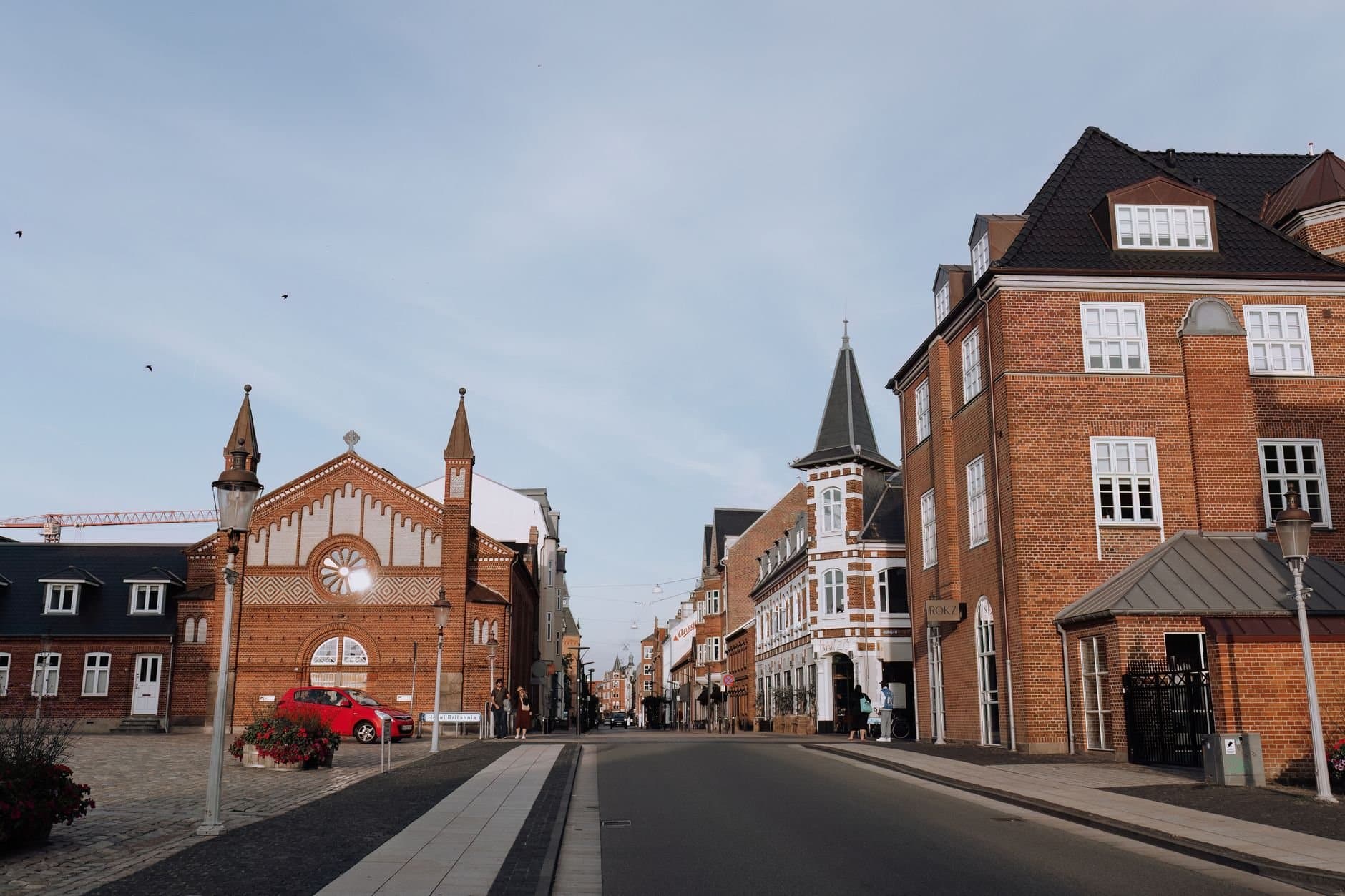 Discover the historic architecture of Esbjerg's old town with red brick buildings and a town square.