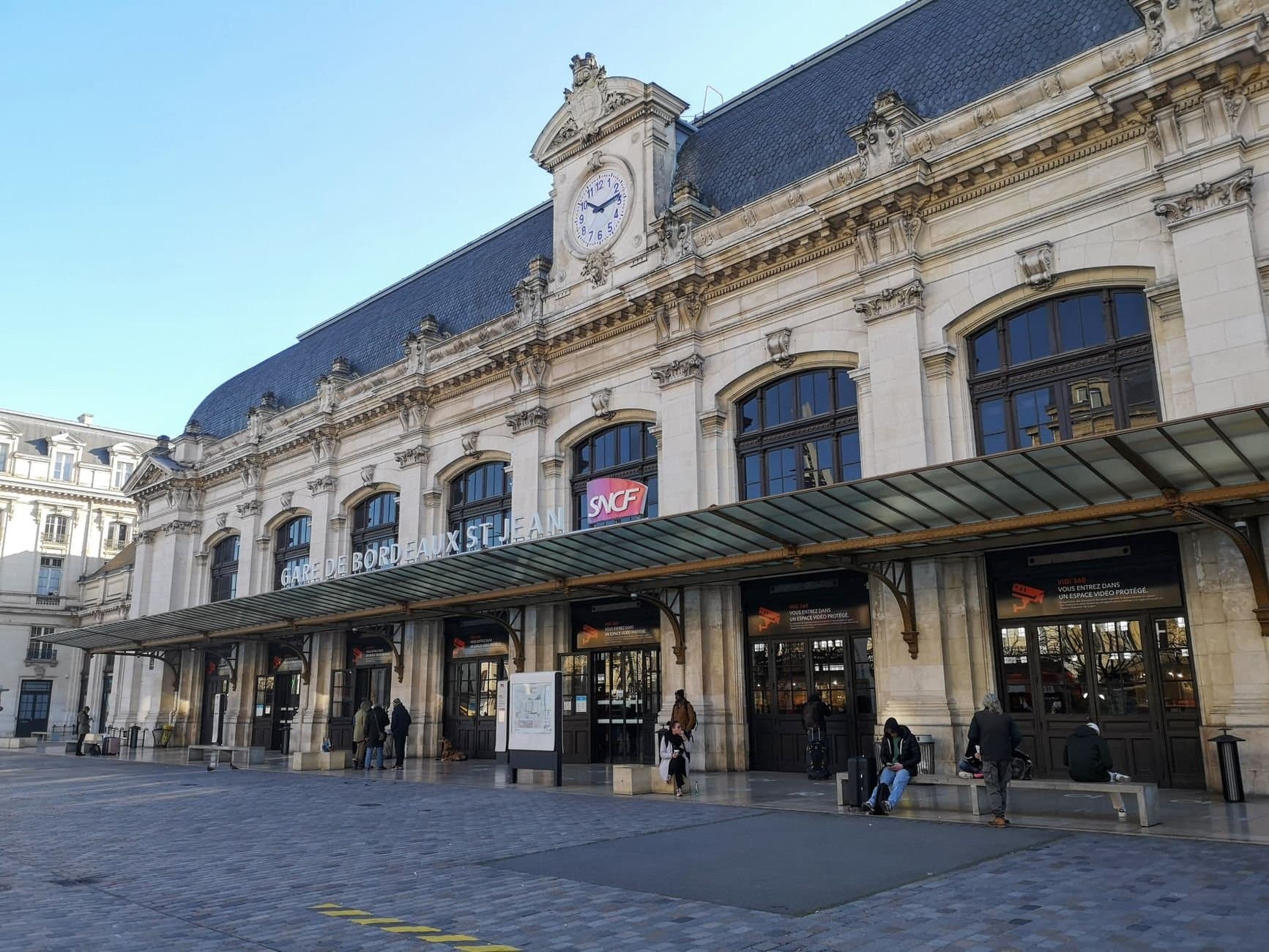 Exterior view of Gare de Bordeaux-Saint-Jean, a key railway station in Bordeaux, France.