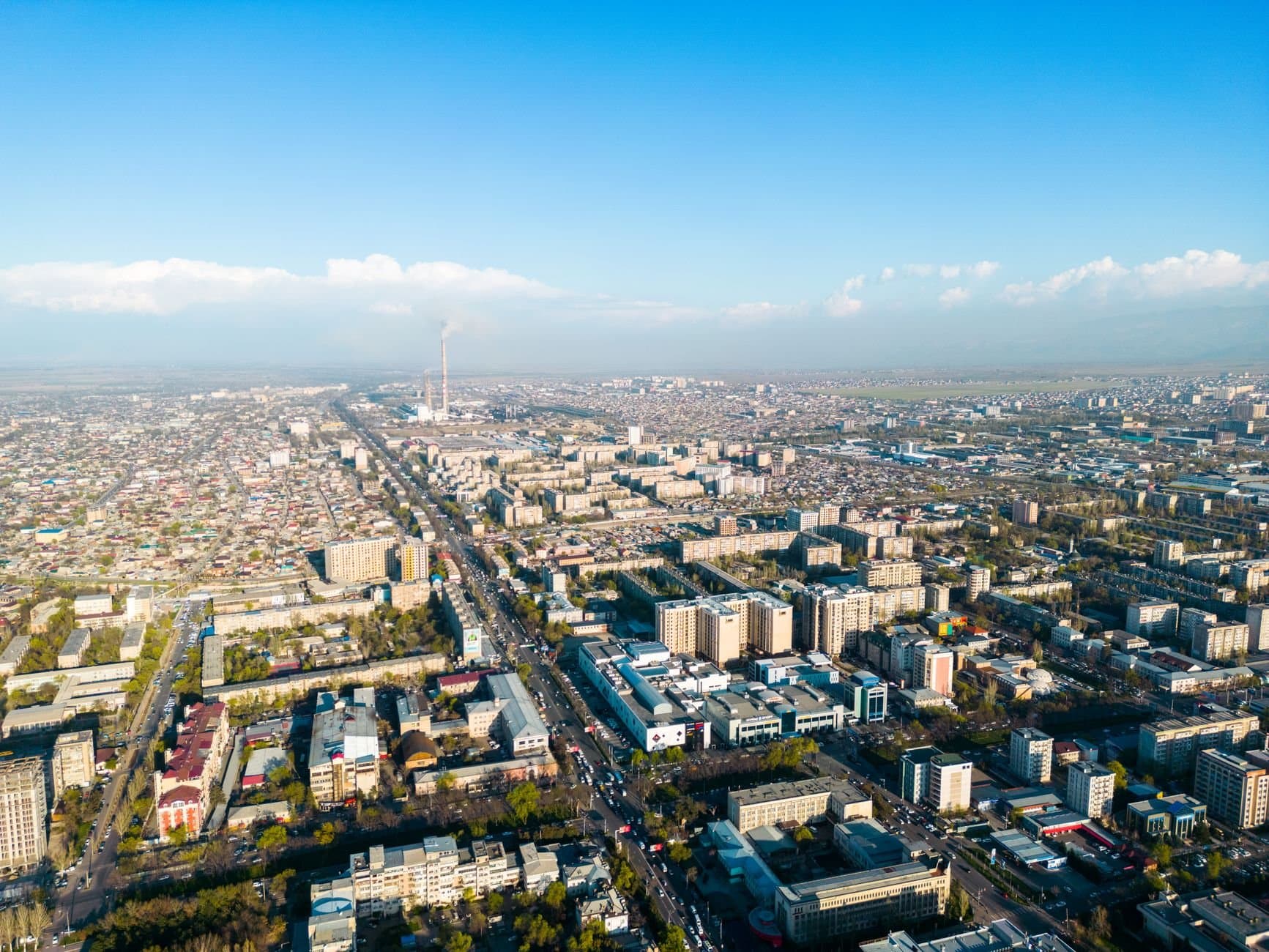 Drone shot capturing the expansive urban landscape of Bishkek, Kyrgyzstan.