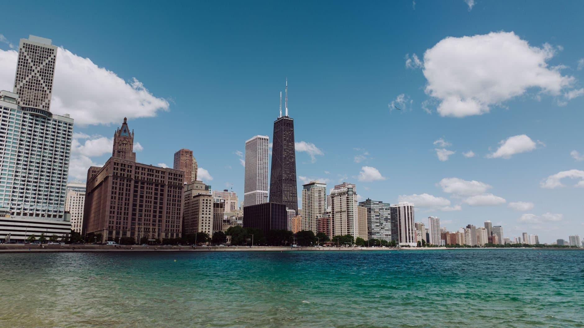 Stunning view of Chicago's skyline with Lake Michigan on a clear day featuring iconic skyscrapers.