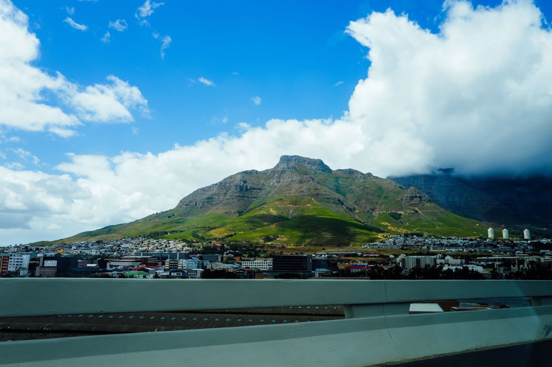 Stunning landscape of Cape Town's iconic Table Mountain under a bright blue sky.