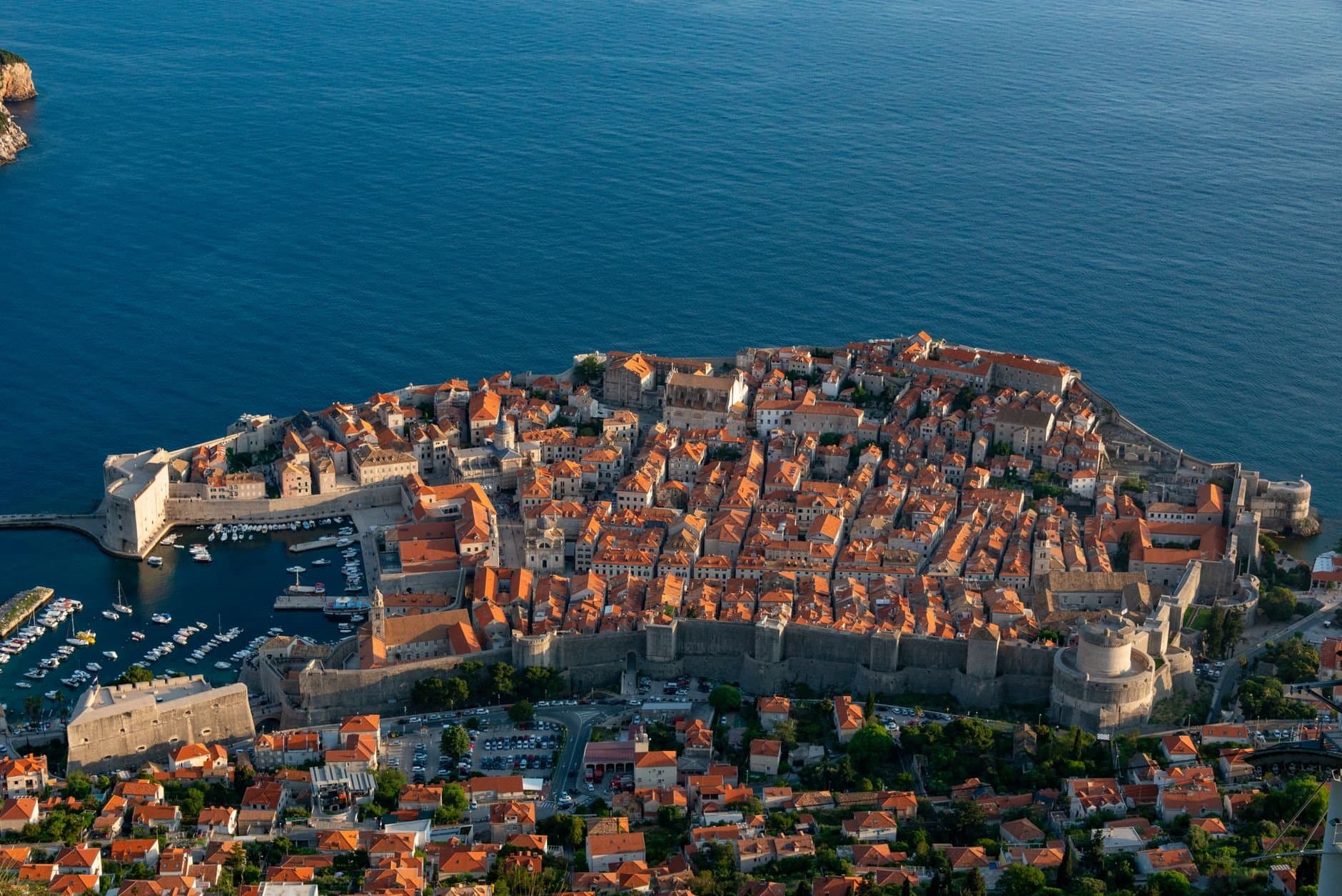 Stunning aerial view of Dubrovnik's Old Town by the sea, encircled by ancient walls.