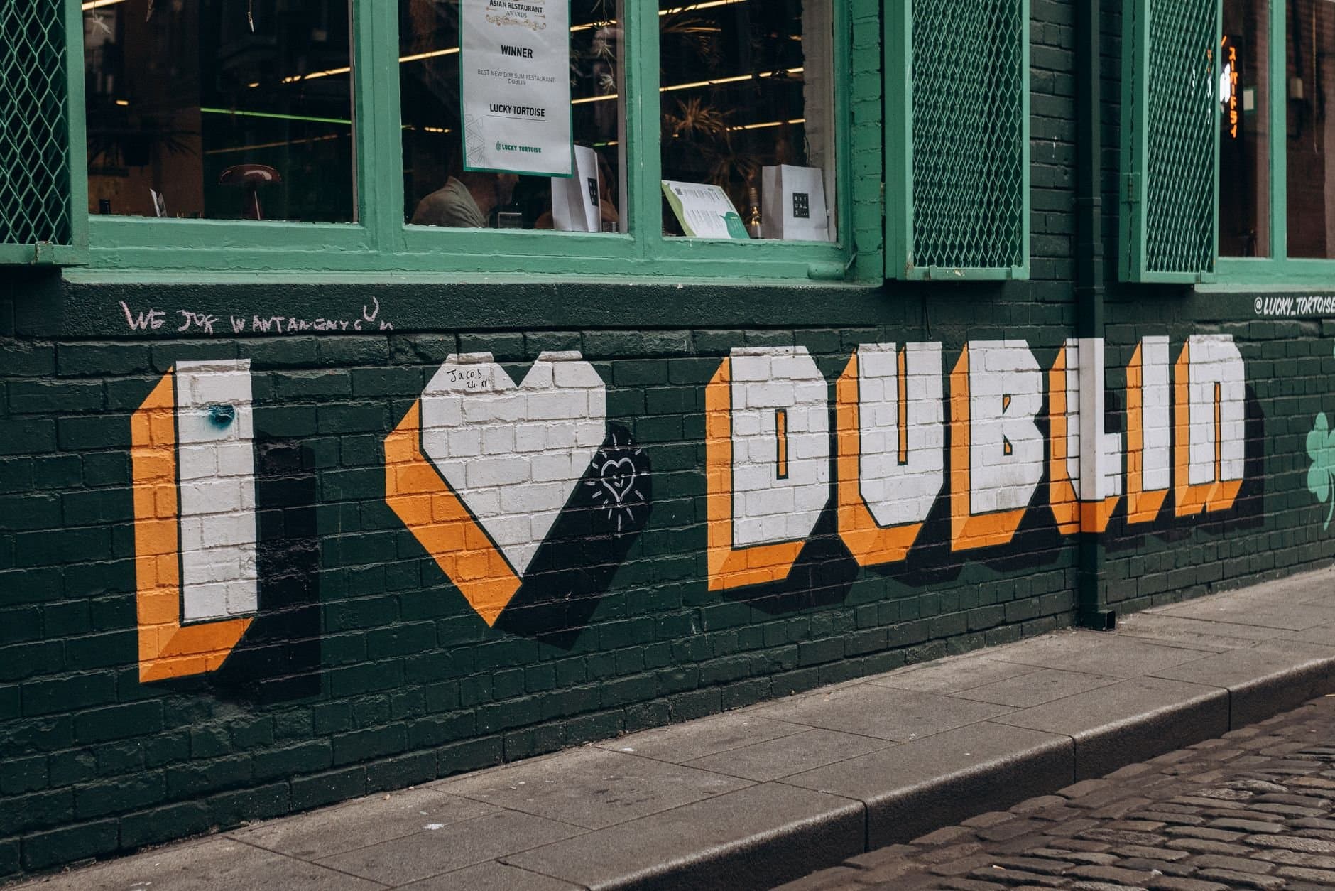 Colorful street art on a Dublin wall showcasing vibrant urban culture.