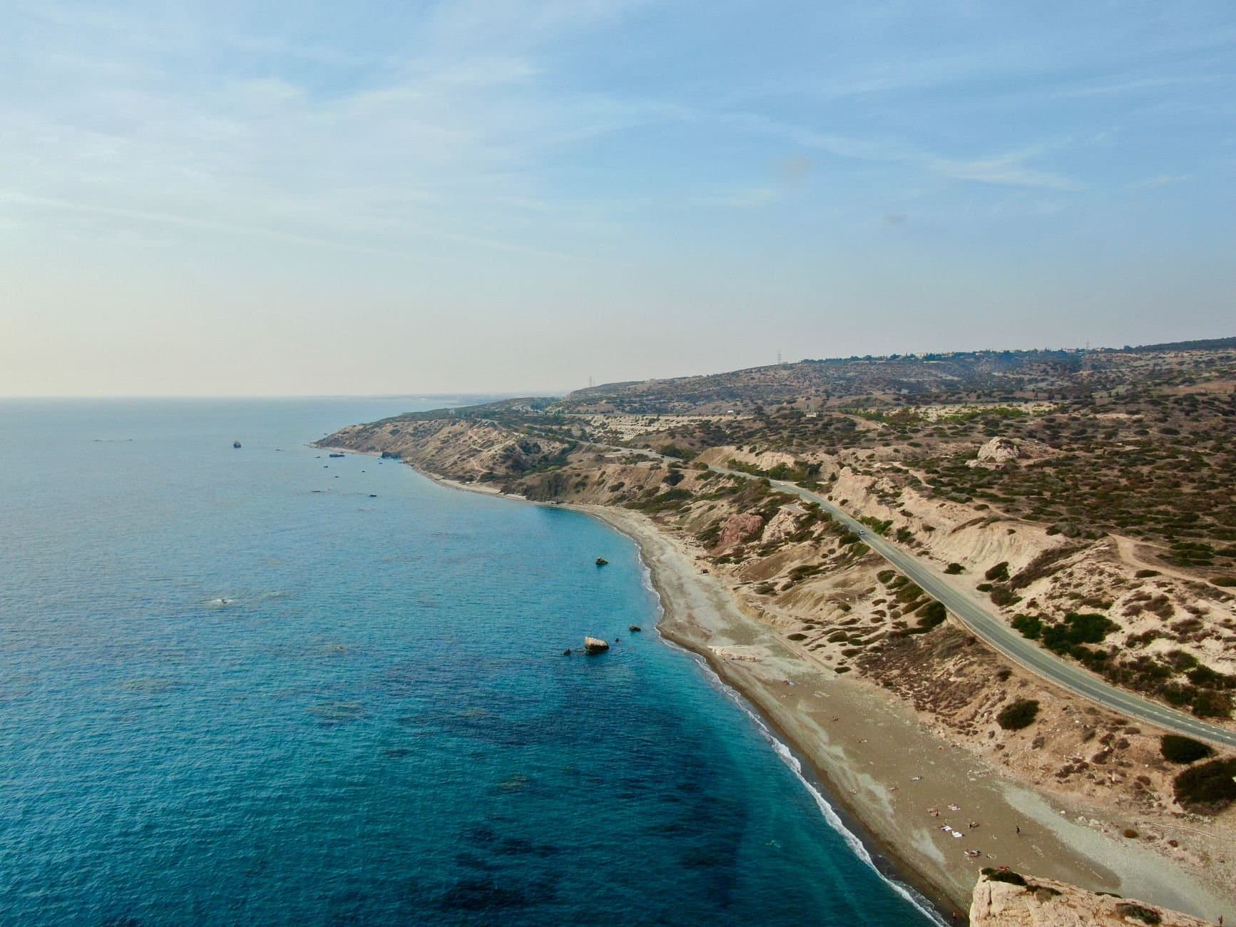 Breathtaking aerial view of Kouklia coast with stunning blue sea and rocky seashore in Cyprus.