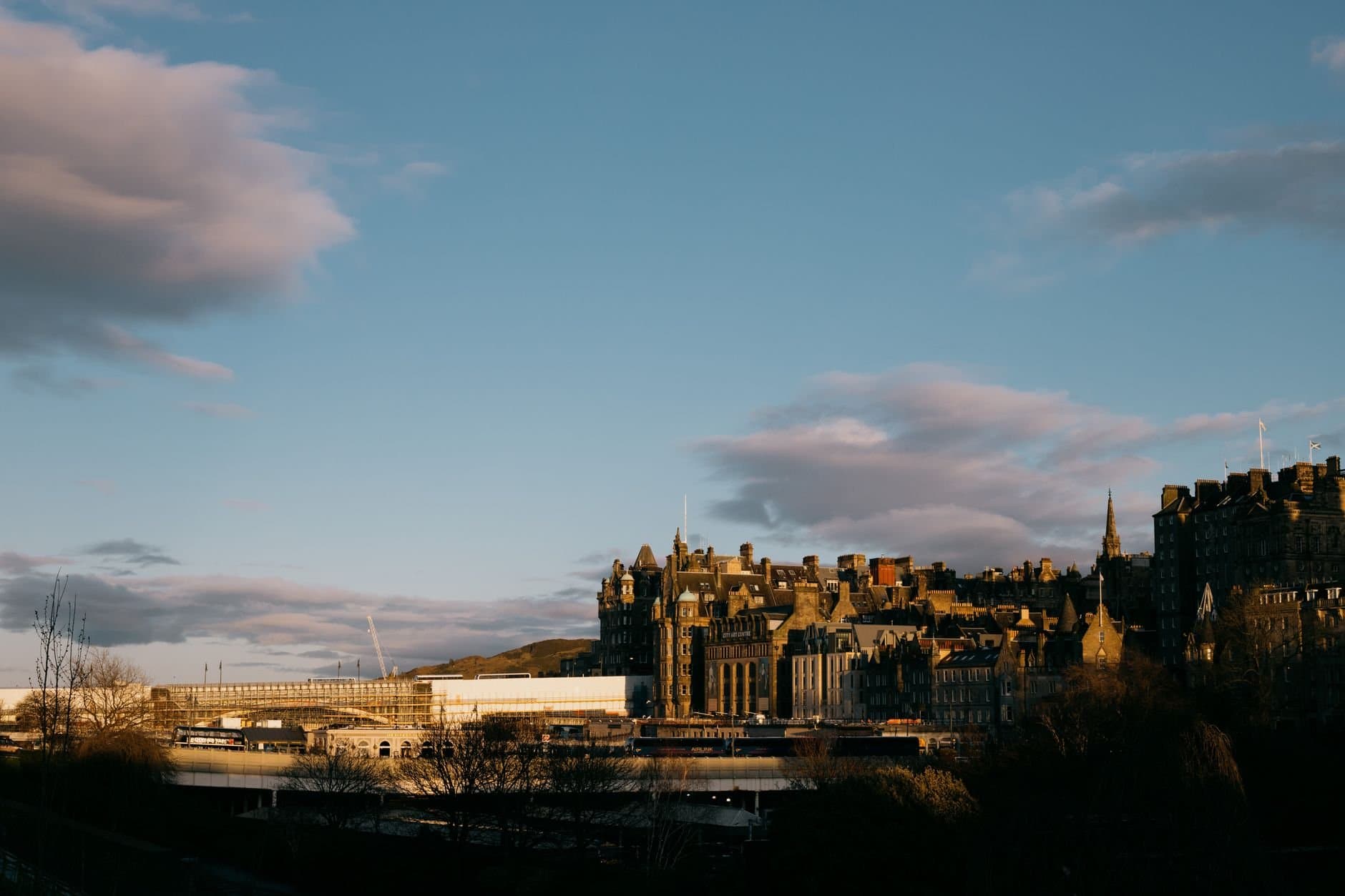 View of Edinburgh's historic architecture against a stunning sunset sky.