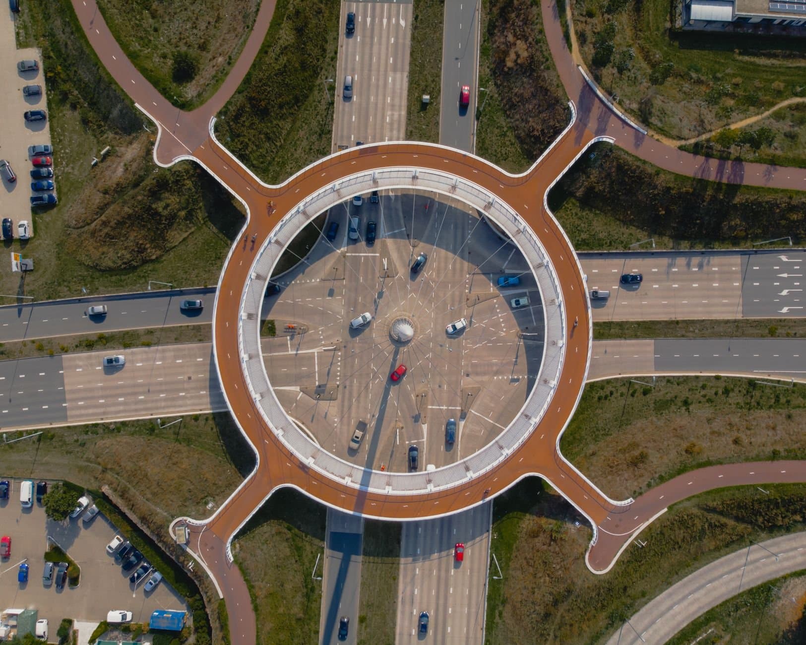 Stunning aerial photo of a modern roundabout in Eindhoven, showcasing intricate road design.