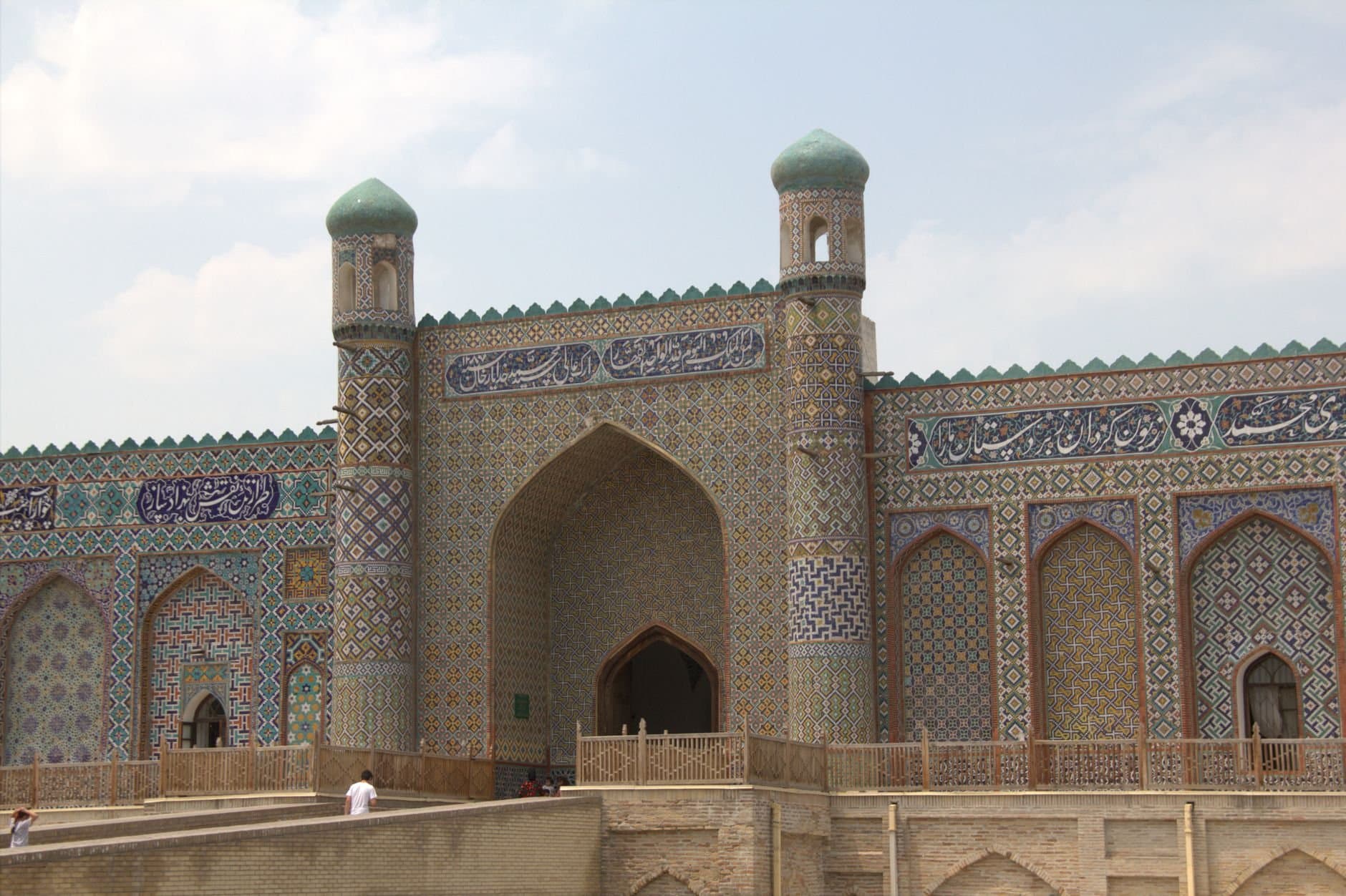 A beautifully detailed Islamic building facade in Kokand, showcasing intricate tile patterns and stunning design.