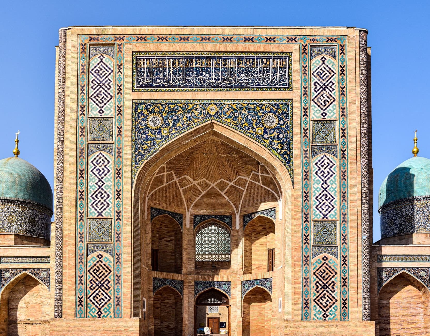 Showcasing the intricate facade of the Barakhan Madrasah in Tashkent, Uzbekistan.