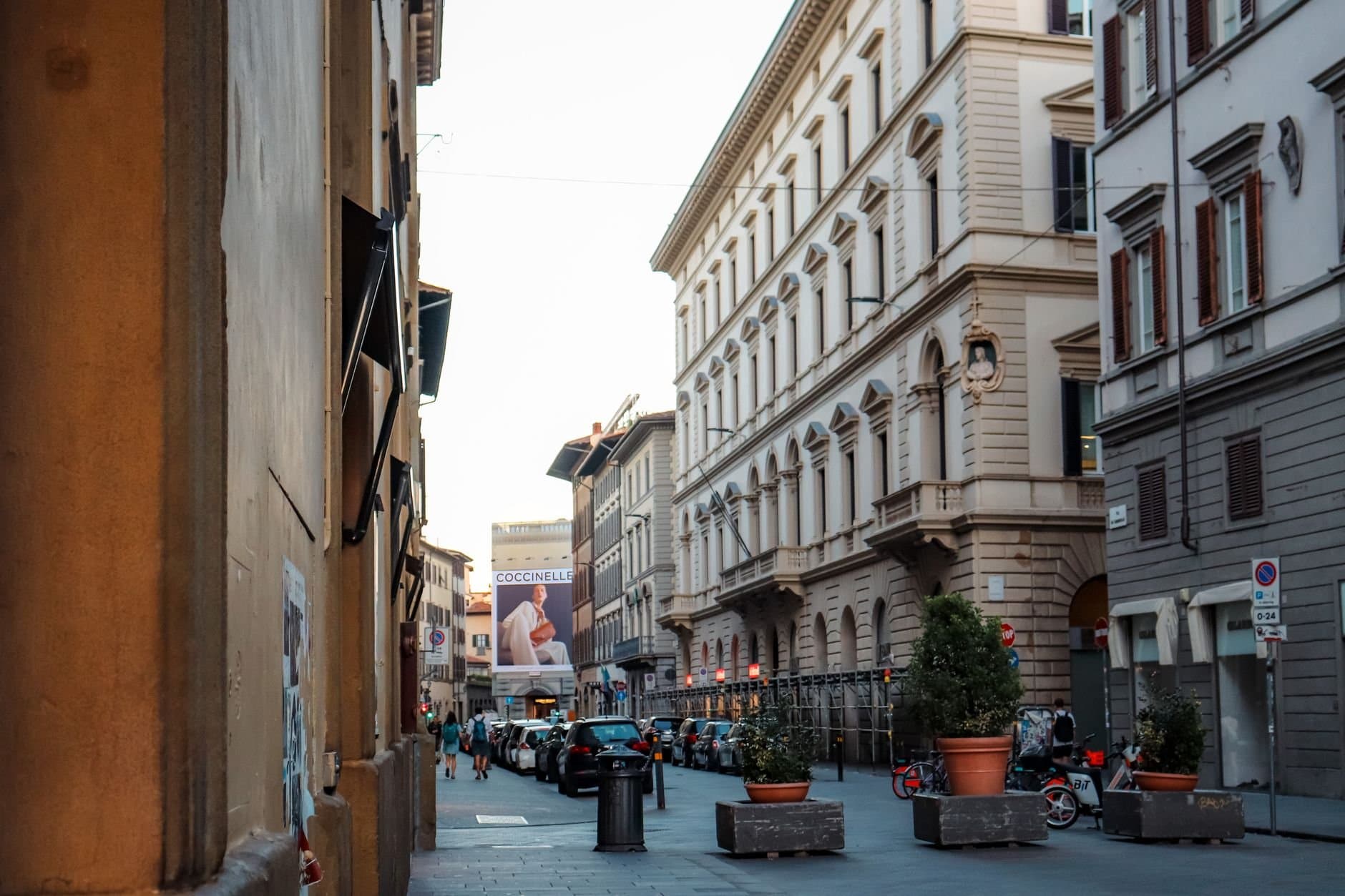 Picturesque street in Florence, Italy with classic architecture and vibrant city life.