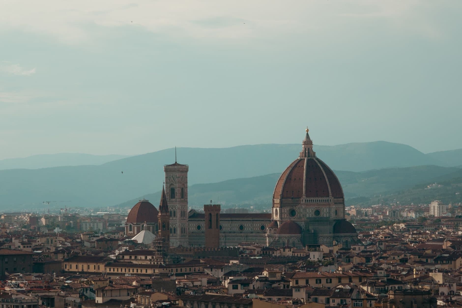 Explore the breathtaking aerial view of Florence featuring the iconic Cathedral of Santa Maria del Fiore.
