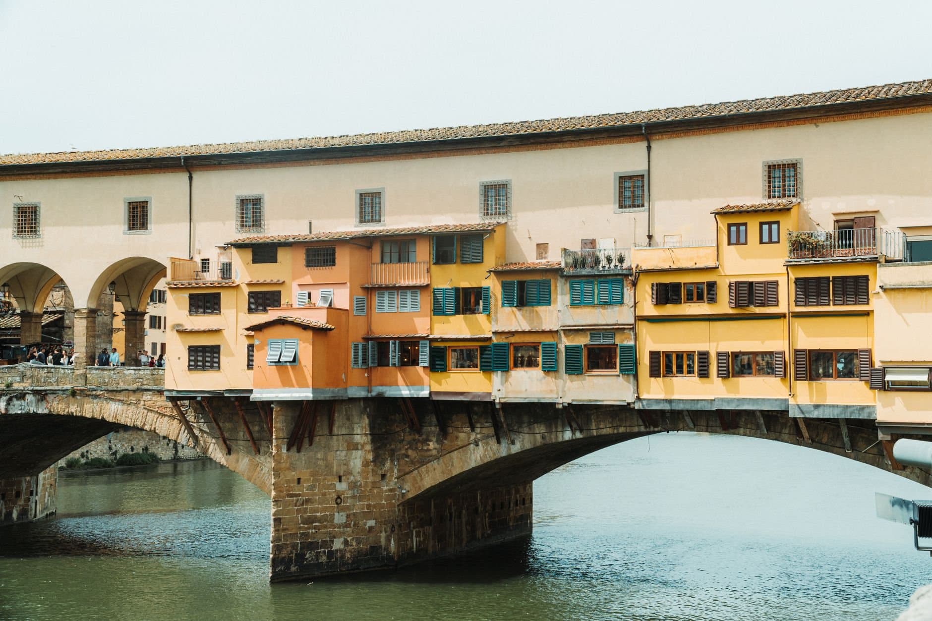 The iconic Ponte Vecchio bridge spanning the Arno River in Florence, Italy.