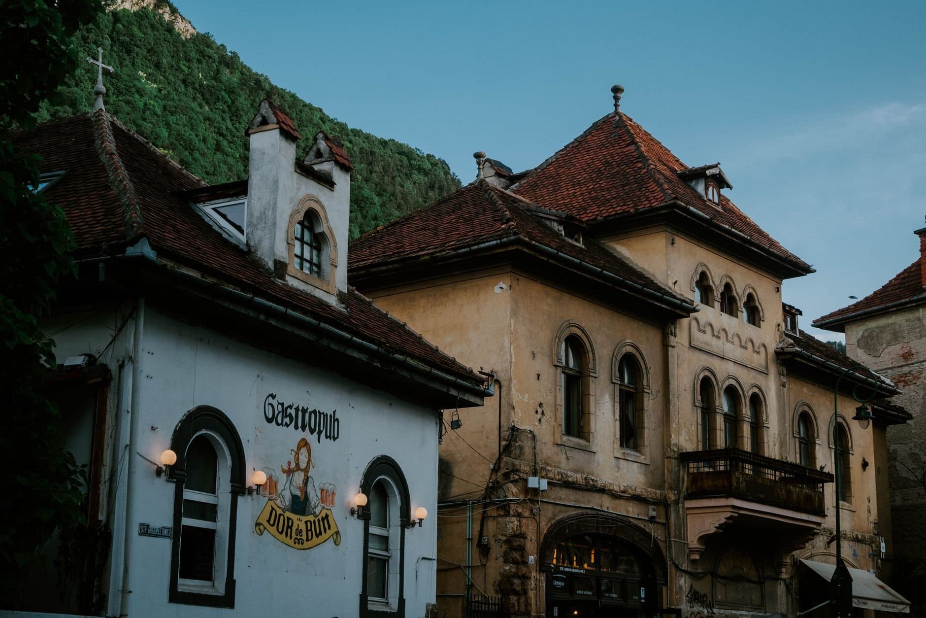 Explore the rustic charm of historic architecture in Brasov, Romania. A serene evening setting.