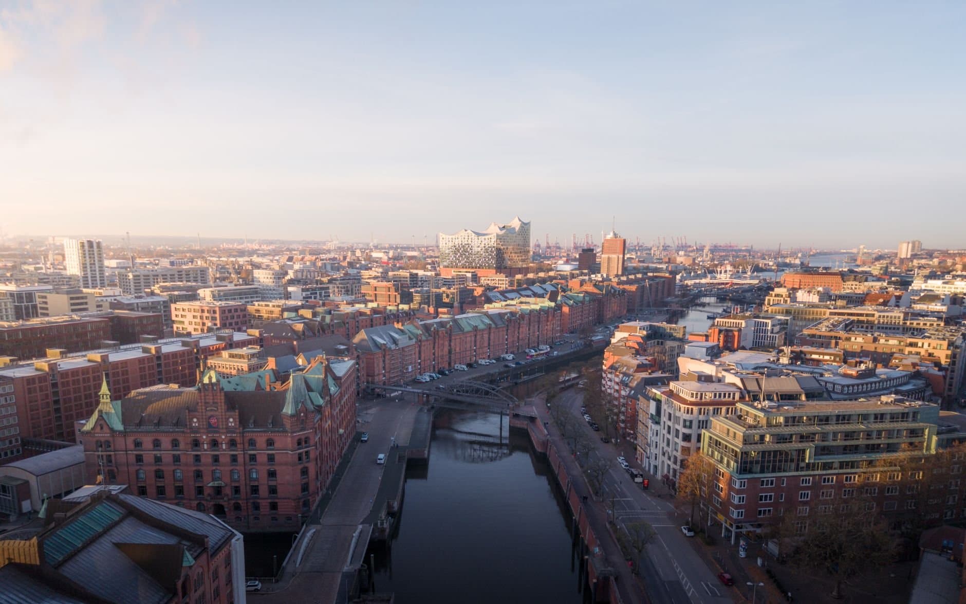 Captivating aerial view of Hamburg's historic Speicherstadt district showcasing iconic architecture under clear skies.