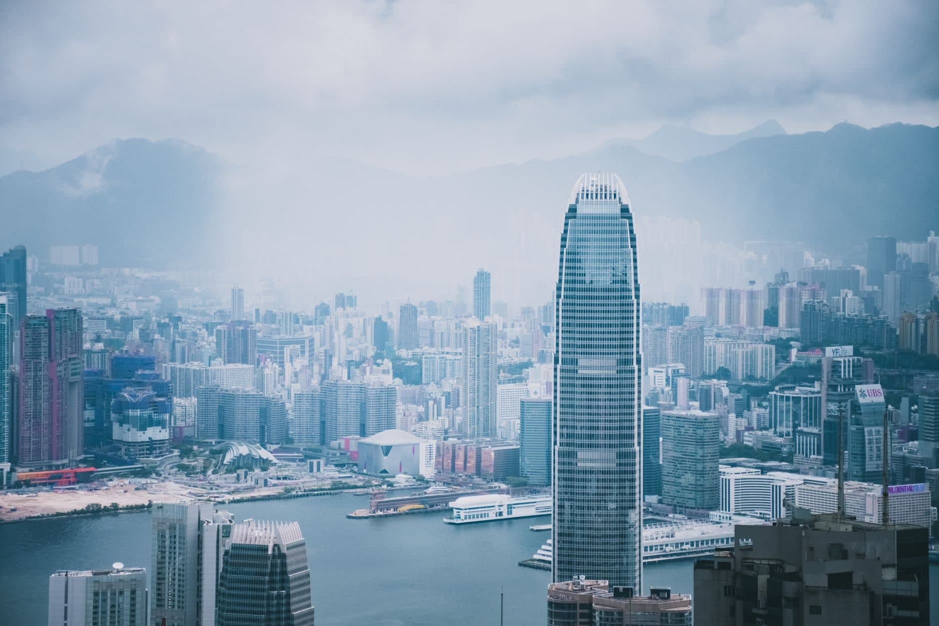 Panoramic view of Hong Kong's modern skyline featuring iconic skyscrapers and urban architecture.