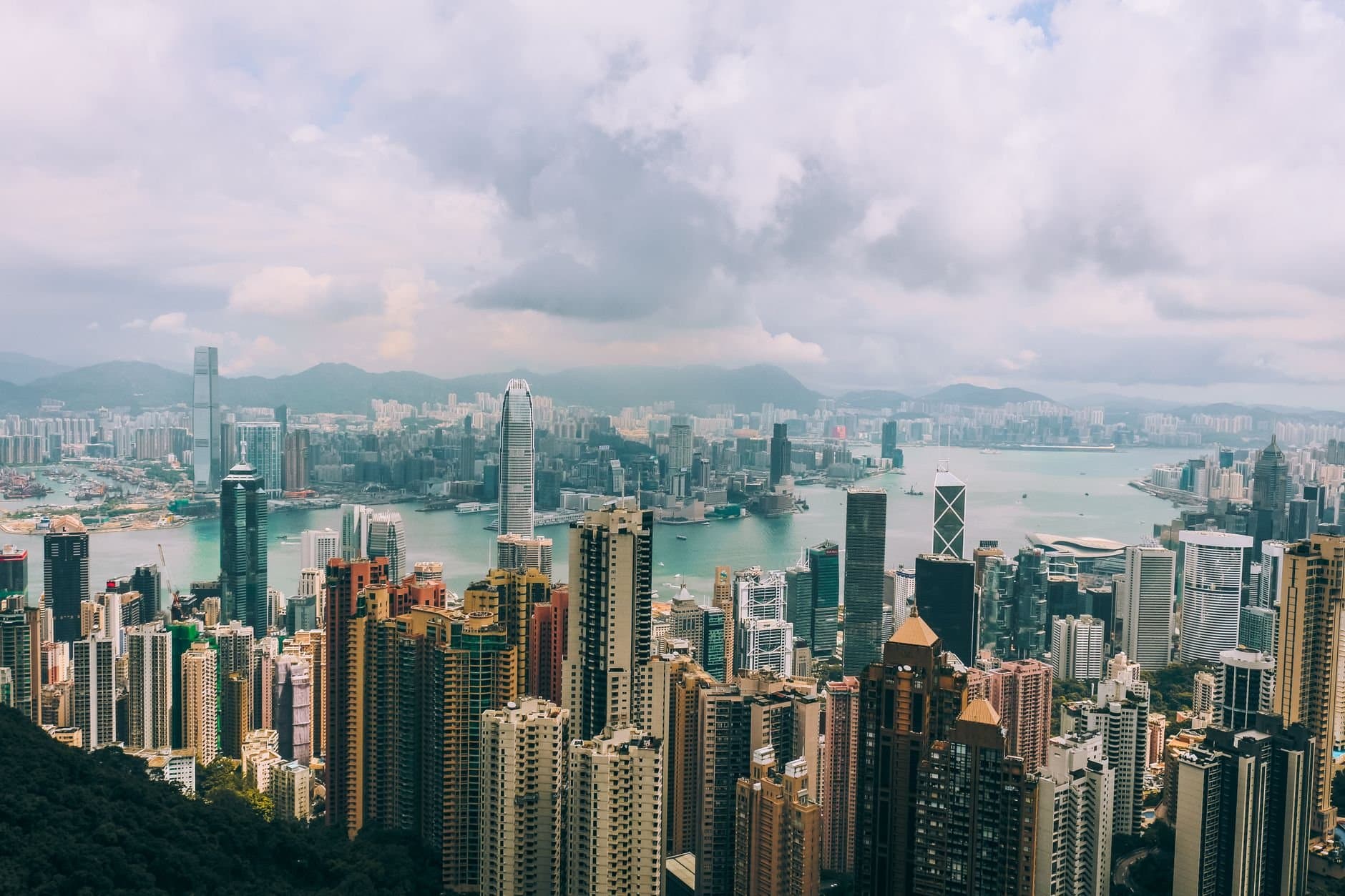 Panoramic view of Hong Kong skyline with skyscrapers and Victoria Harbour from Victoria Peak.