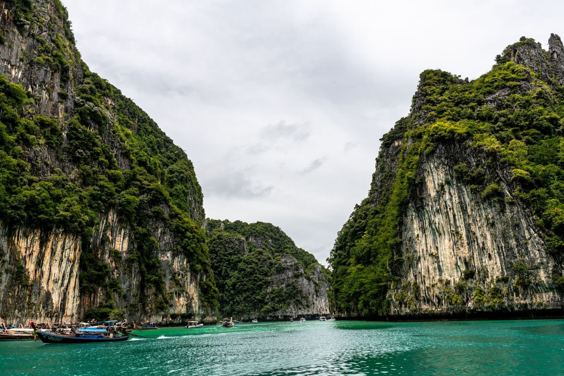 Stunning view of emerald waters surrounded by cliffs in Phuket, Thailand.