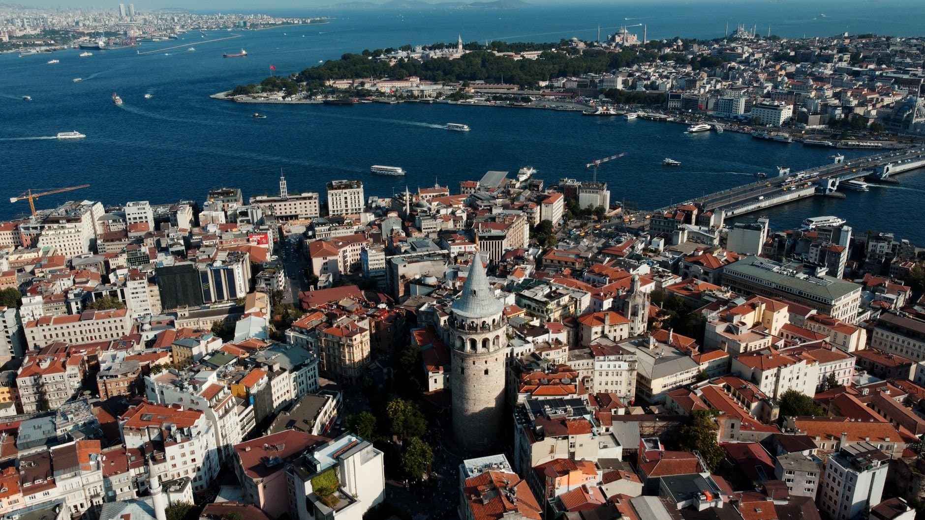 A stunning aerial shot of Galata Tower and Istanbul skyline, showcasing the Bosphorus and historic cityscape.