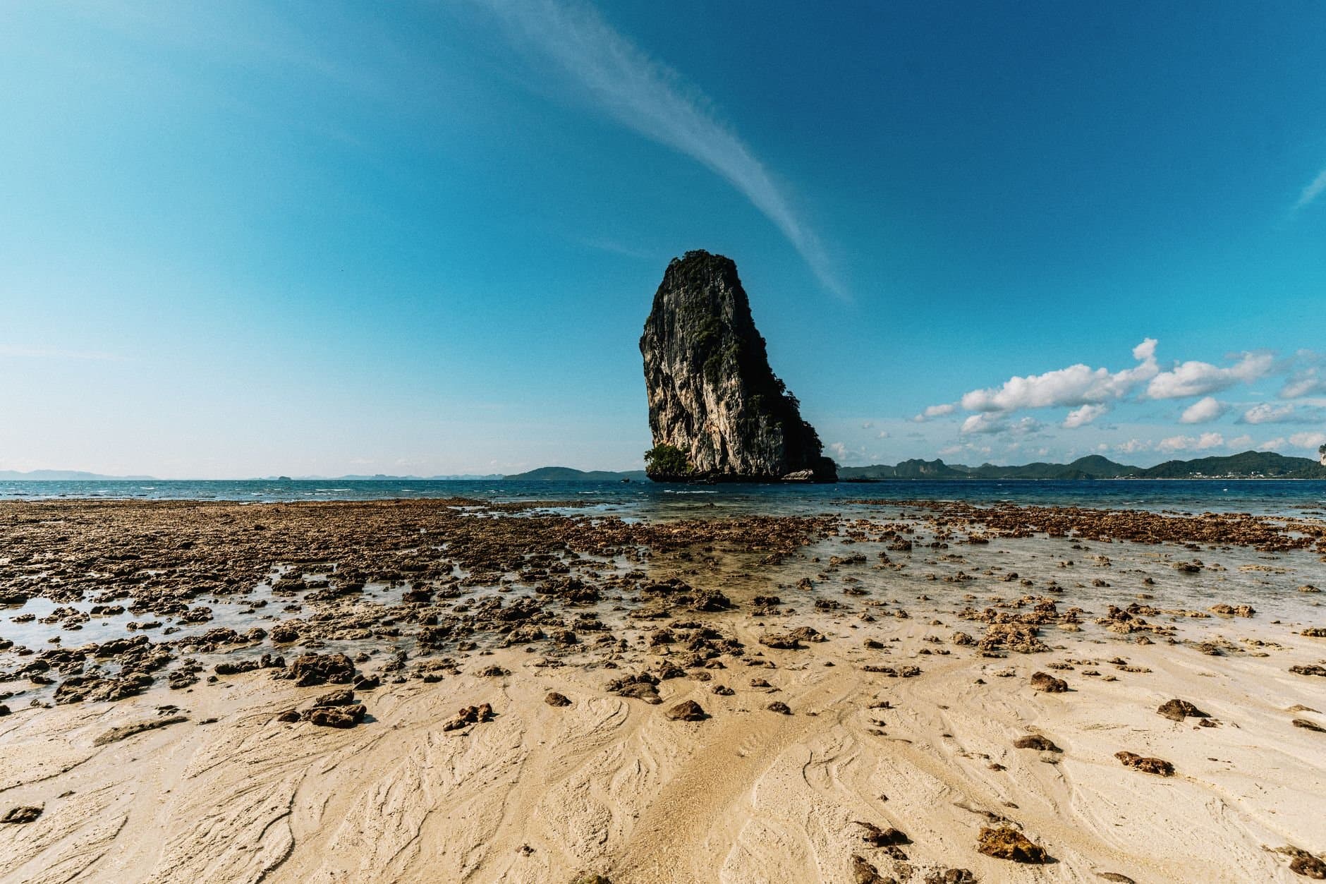Stunning view of a unique rock formation rising from the sea in Phang Nga, Thailand.