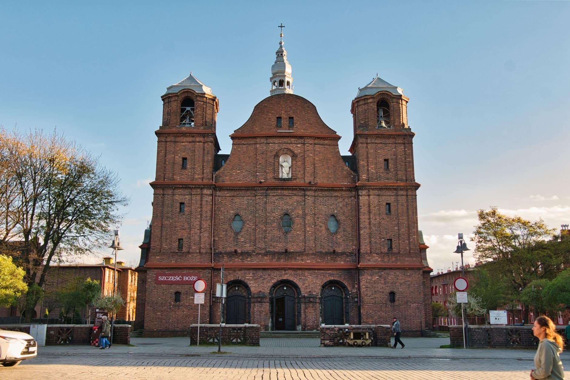 Explore the architectural beauty of a historic brick church in Katowice, Poland.