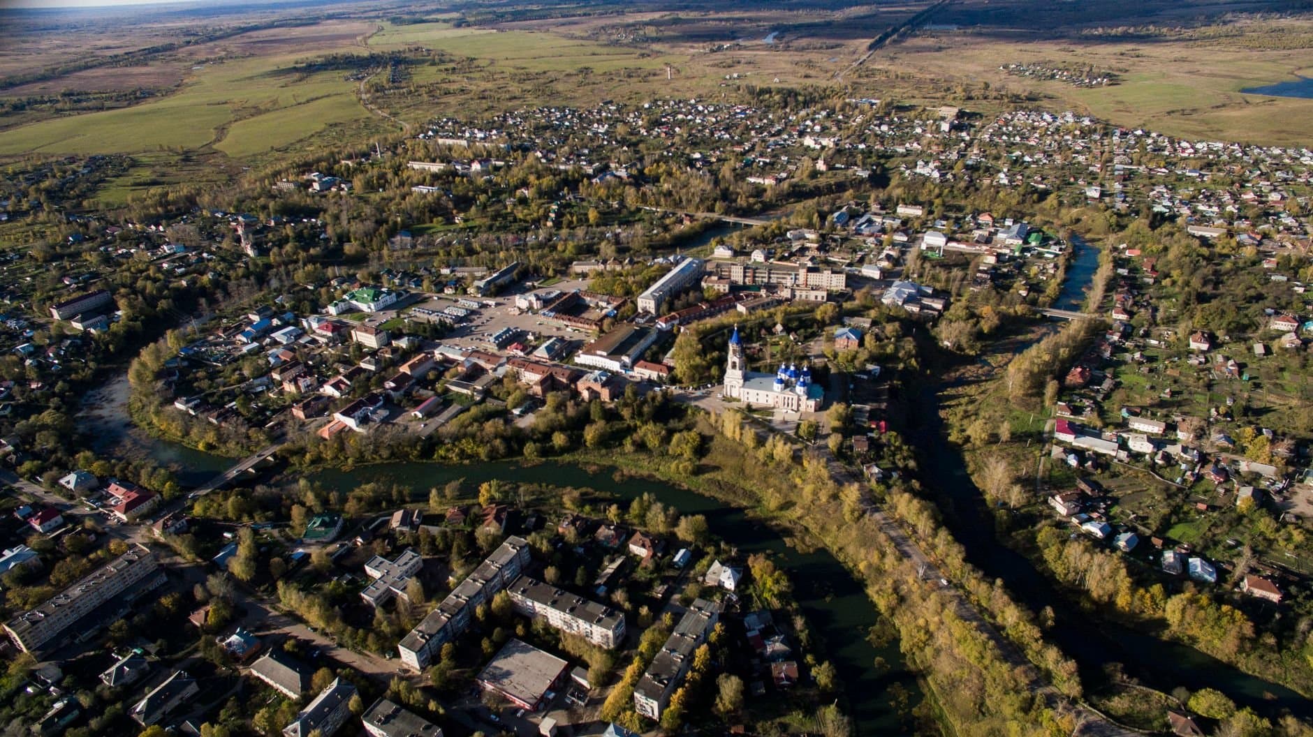 Stunning aerial view of Kashin, a quaint town in Tverskaya oblast', Russia, surrounded by lush greenery.