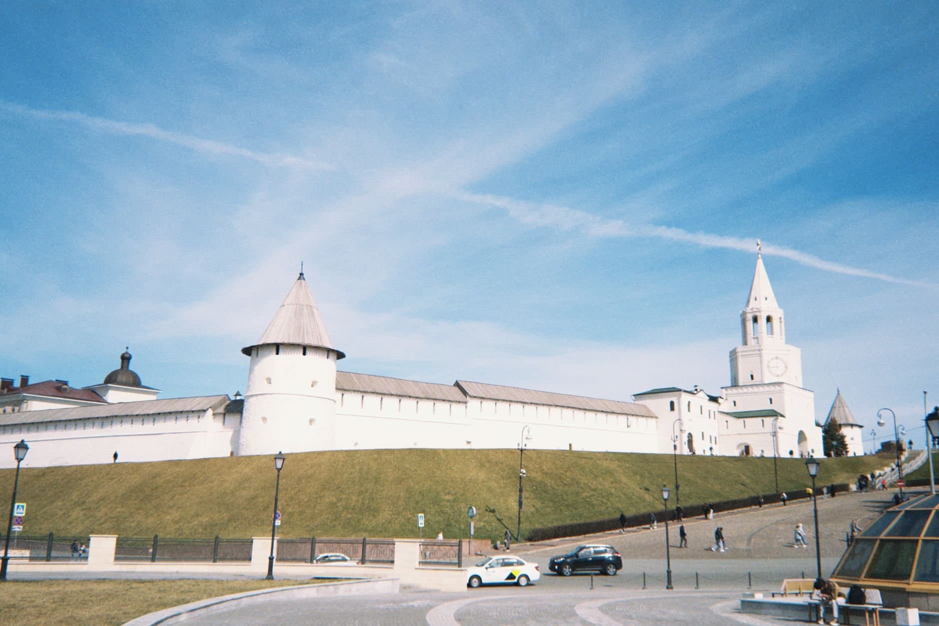 Scenic view of the Kazan Kremlin with its white walls and towers under a clear blue sky.