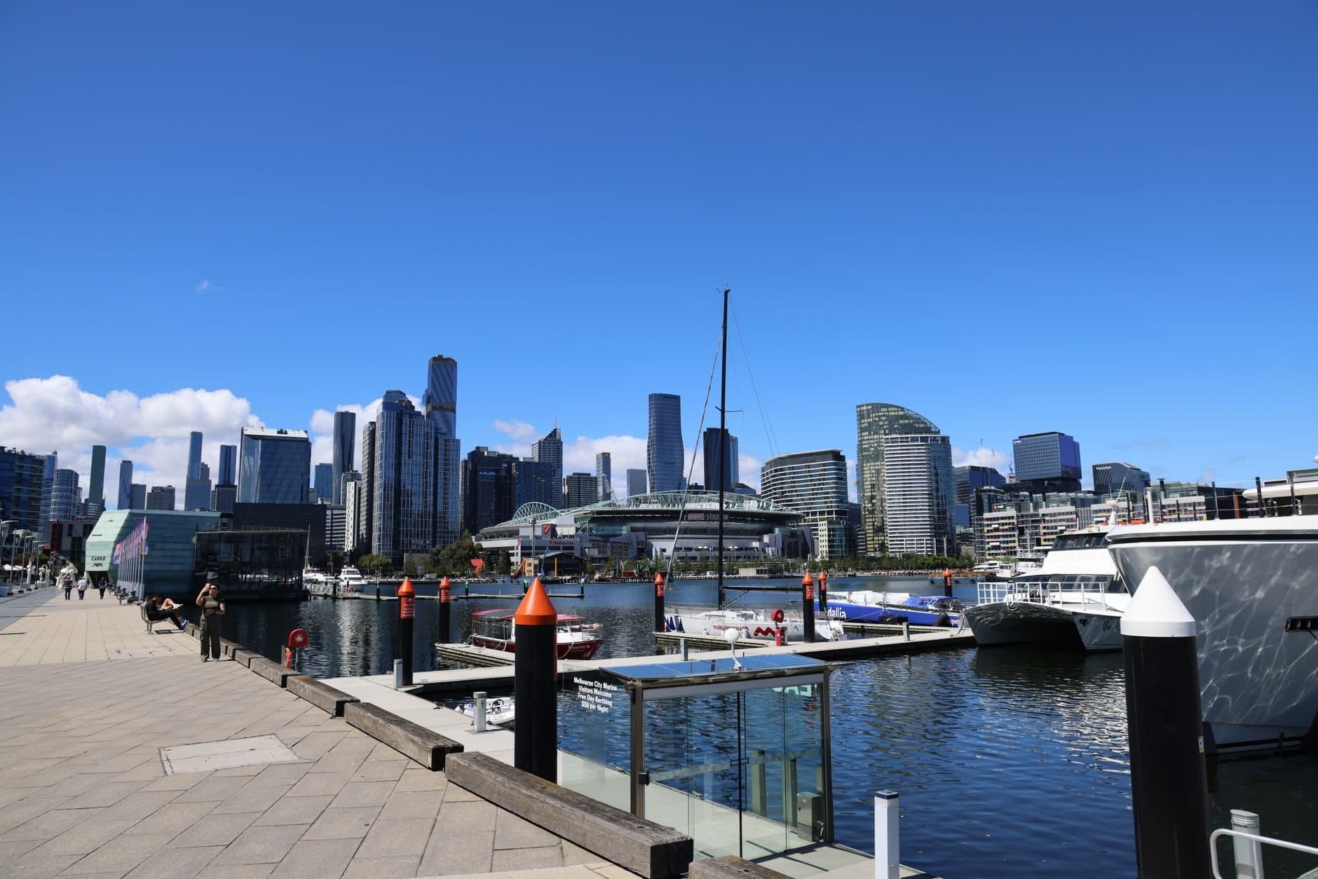 Explore Melbourne's modern skyline and scenic waterfront on a clear sunny day.