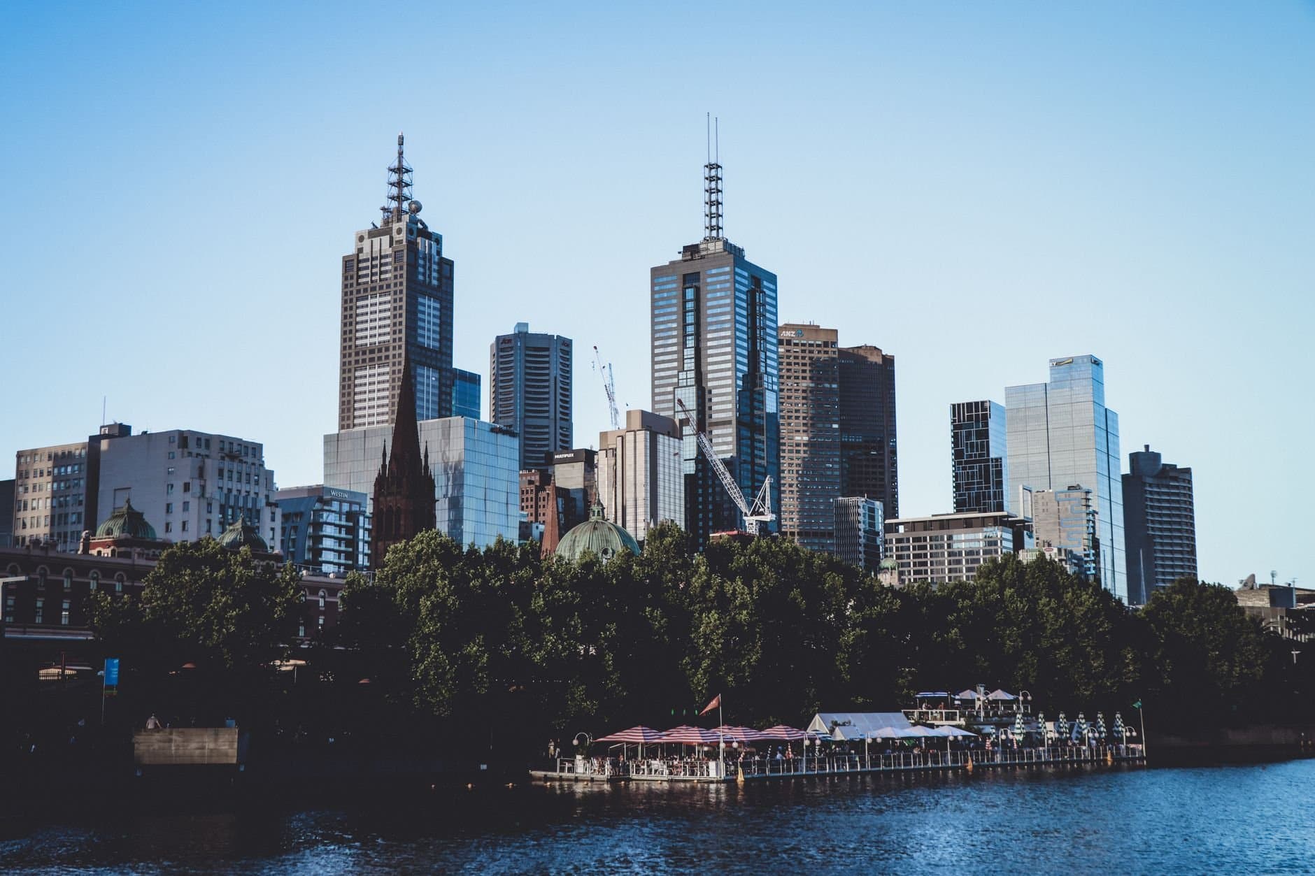 A breathtaking view of Melbourne's skyline over the waterfront, showcasing modern skyscrapers.