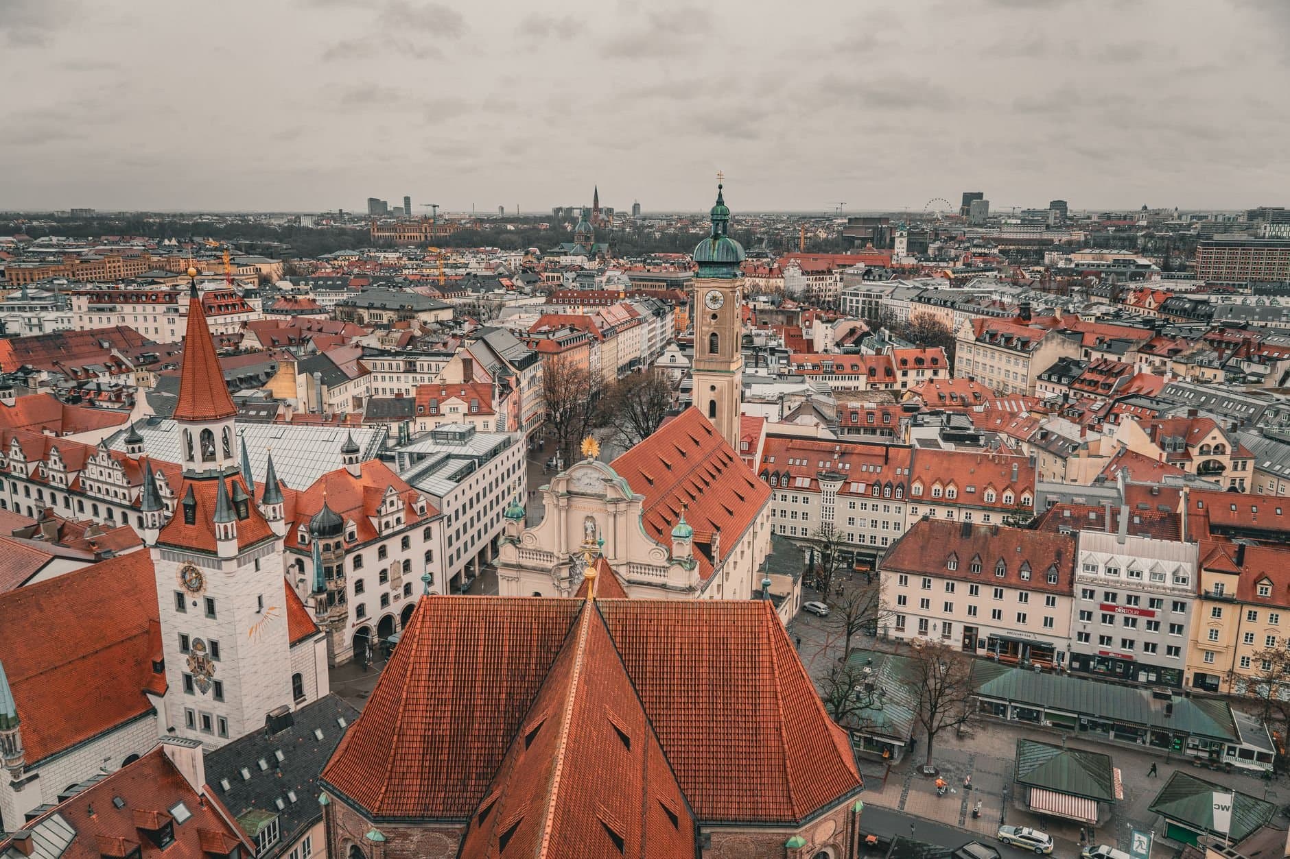 Aerial photo showcasing the historic architecture and vibrant rooftops of Munich's old town.