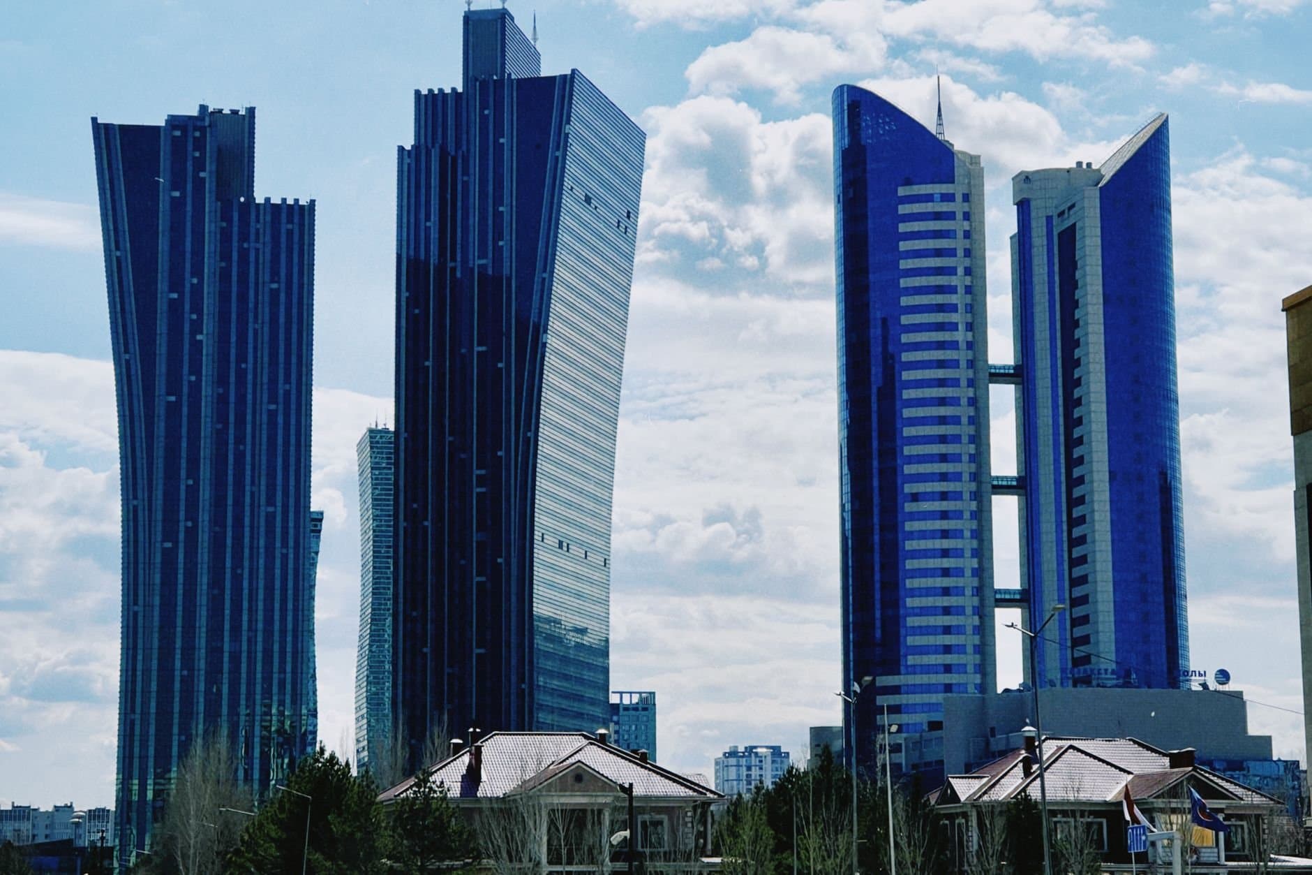 Striking view of modern skyscrapers under a blue sky in Astana, Kazakhstan.