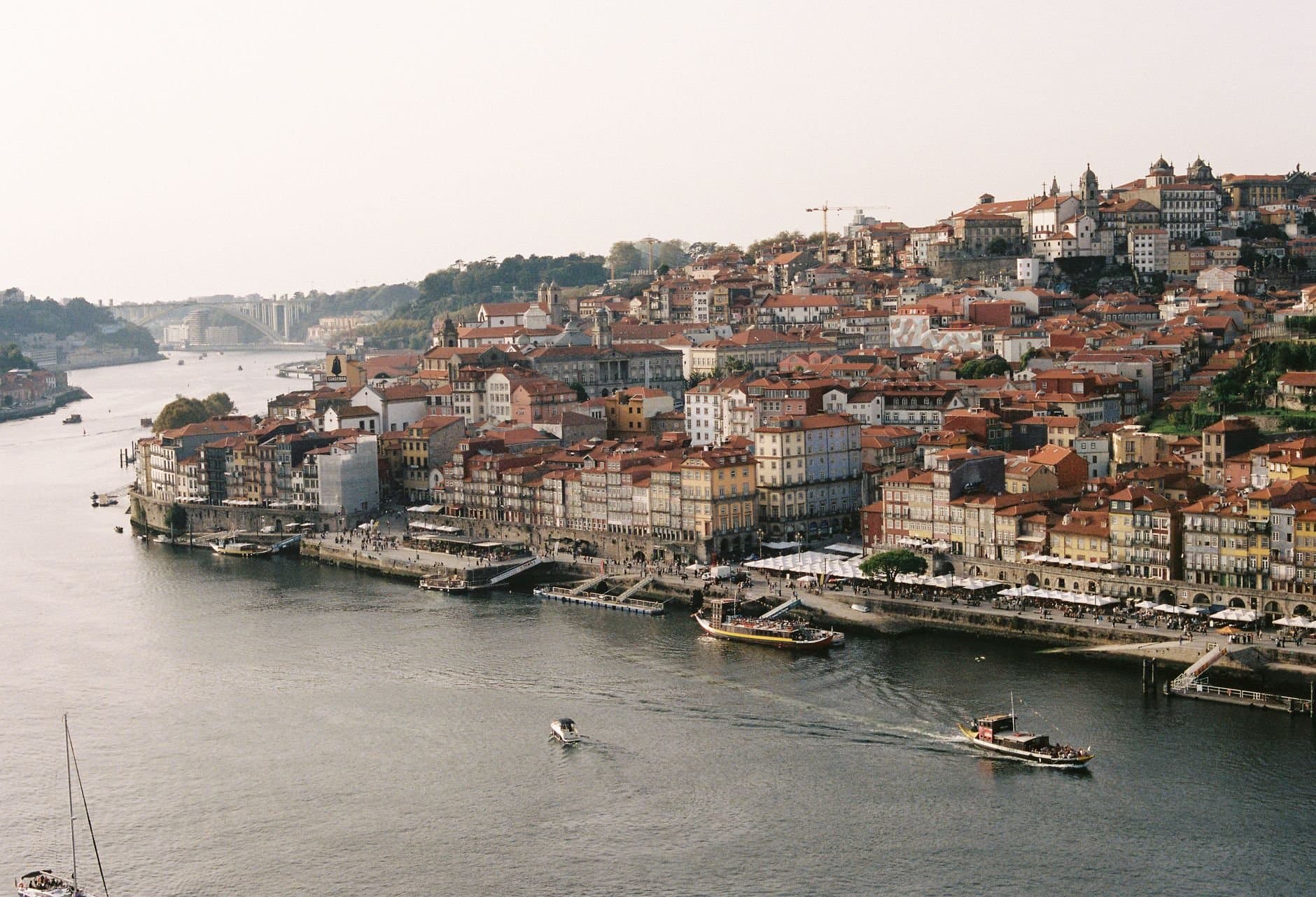 Aerial view of Porto's charming riverside with historical architecture along the Douro River.