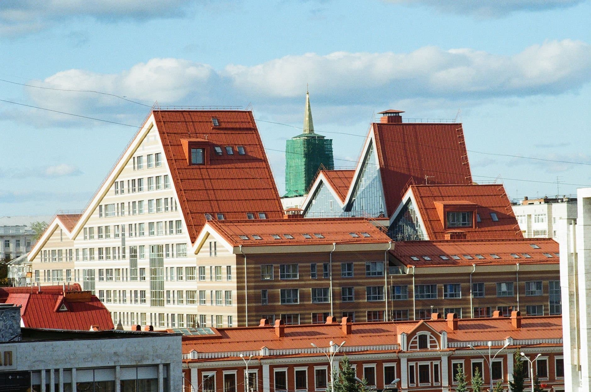 Explore the distinct architectural design of Perm's modern cityscape under a clear sky.