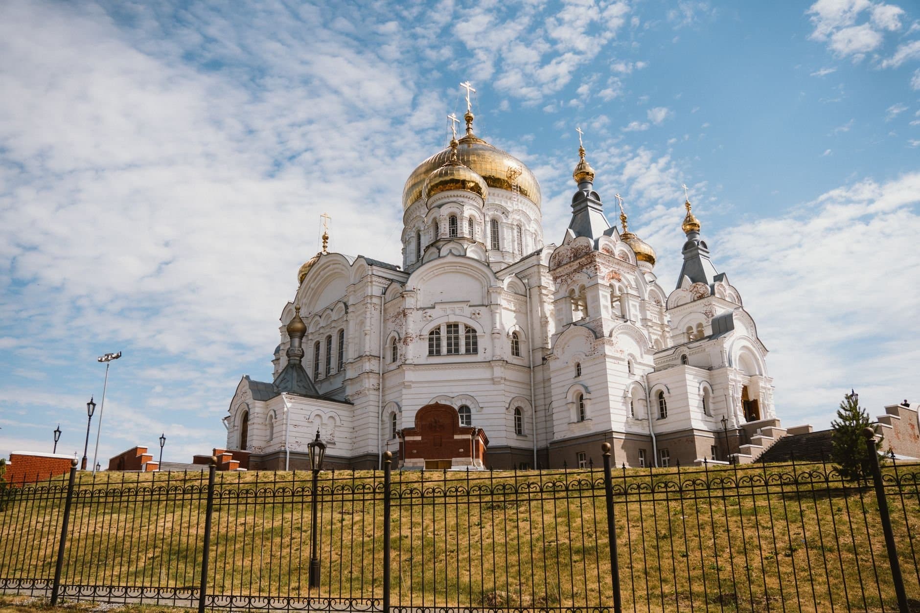 Stunning view of Belogorsky Monastery showcasing its Byzantine architecture under a blue sky.
