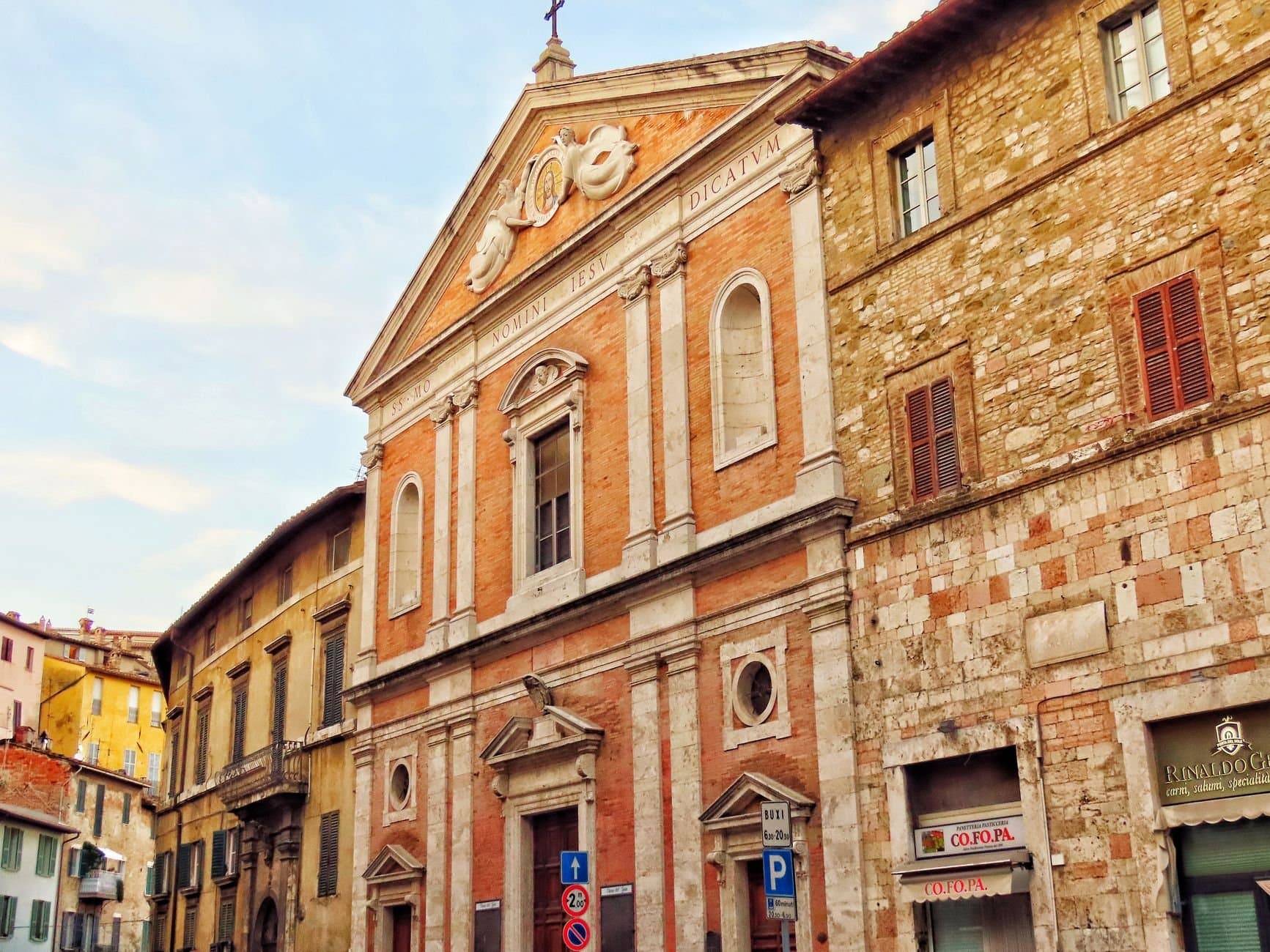 Charming historic church facade in Perugia, Italy, featuring classic architecture.