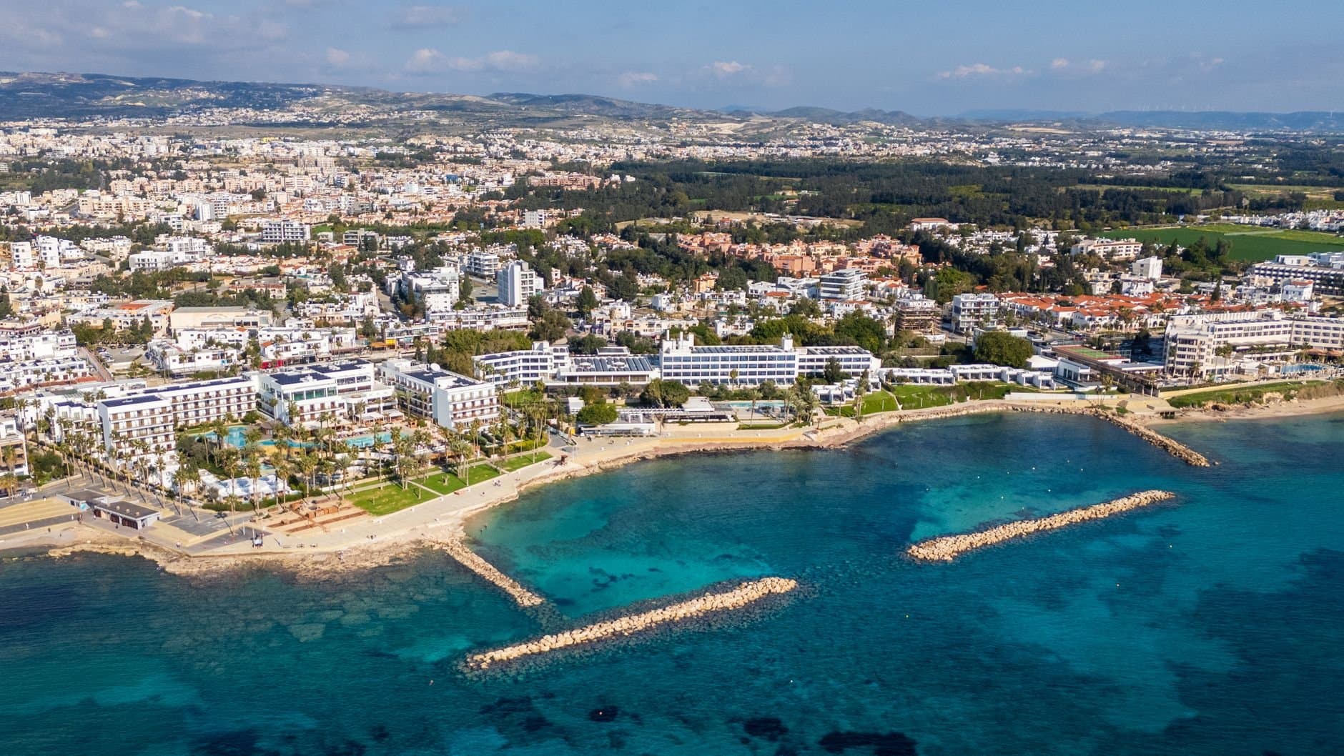 A comprehensive aerial view of Paphos coastline with clear blue waters.